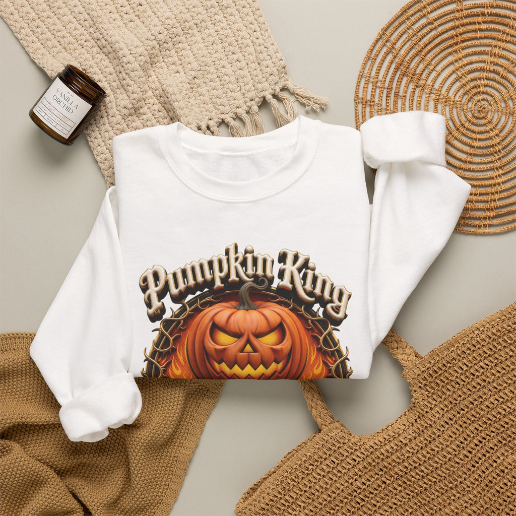 White crewneck sweatshirt styled flat with a candle — two jack-o-lanterns in a thorny wreath