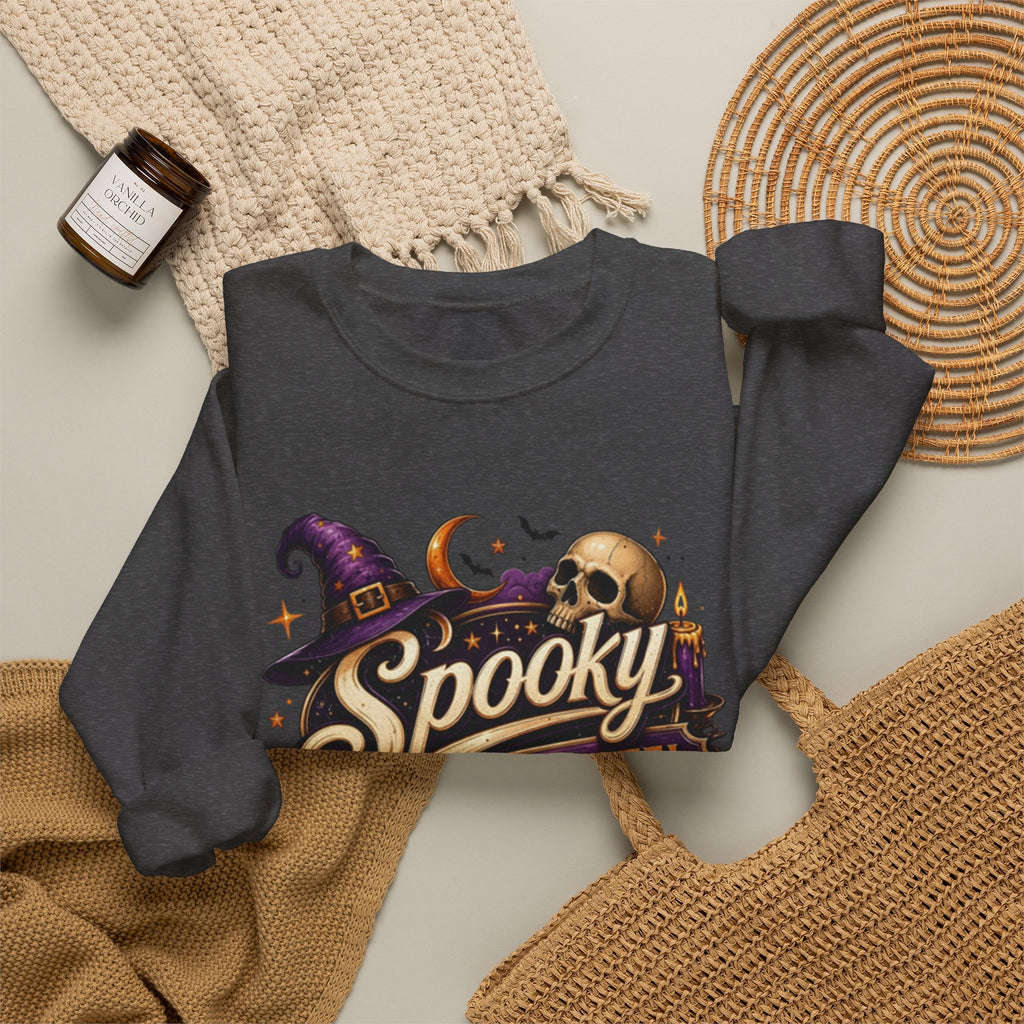 Dark Heather crewneck sweatshirt styled flat with a candle — neon Spooky Witch Motel sign