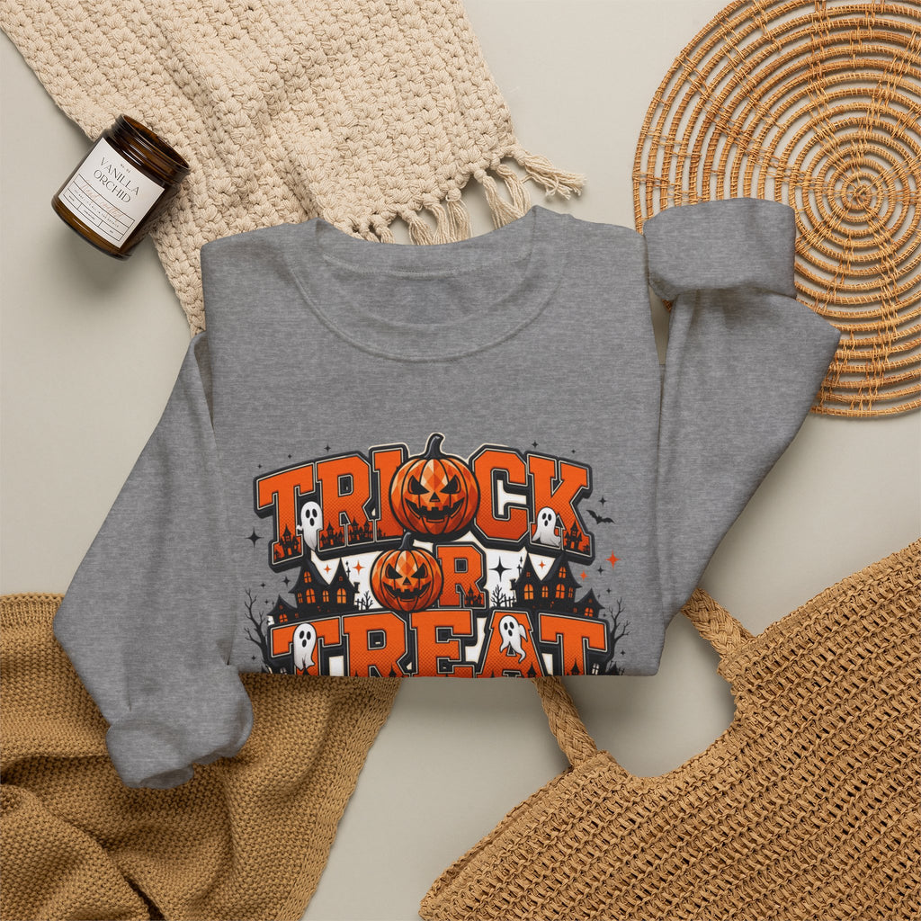 Graphite Heather crewneck sweatshirt styled flat with a candle — stacked orange and black lettering