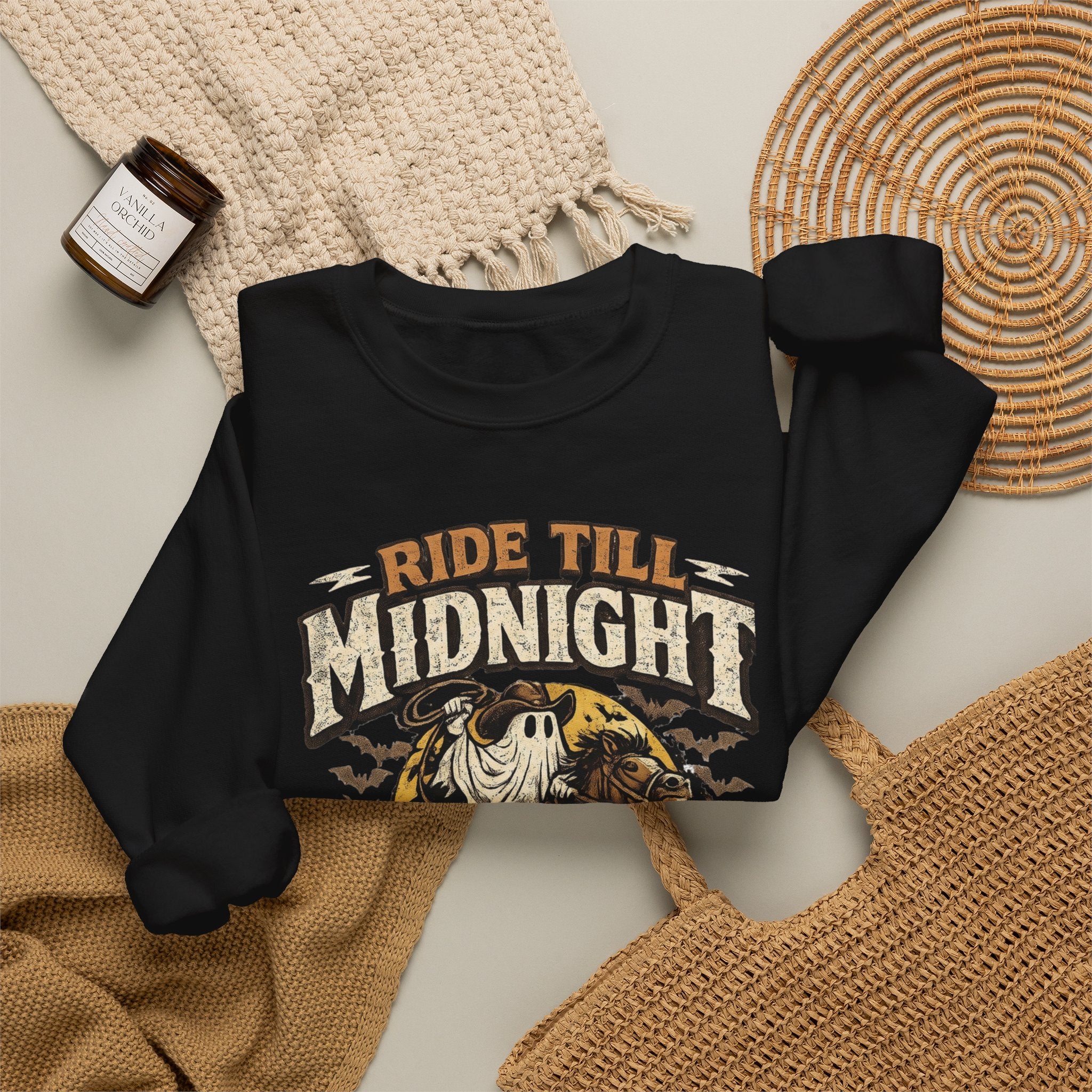 Black crewneck sweatshirt styled flat with a candle — skeleton riding a motorcycle