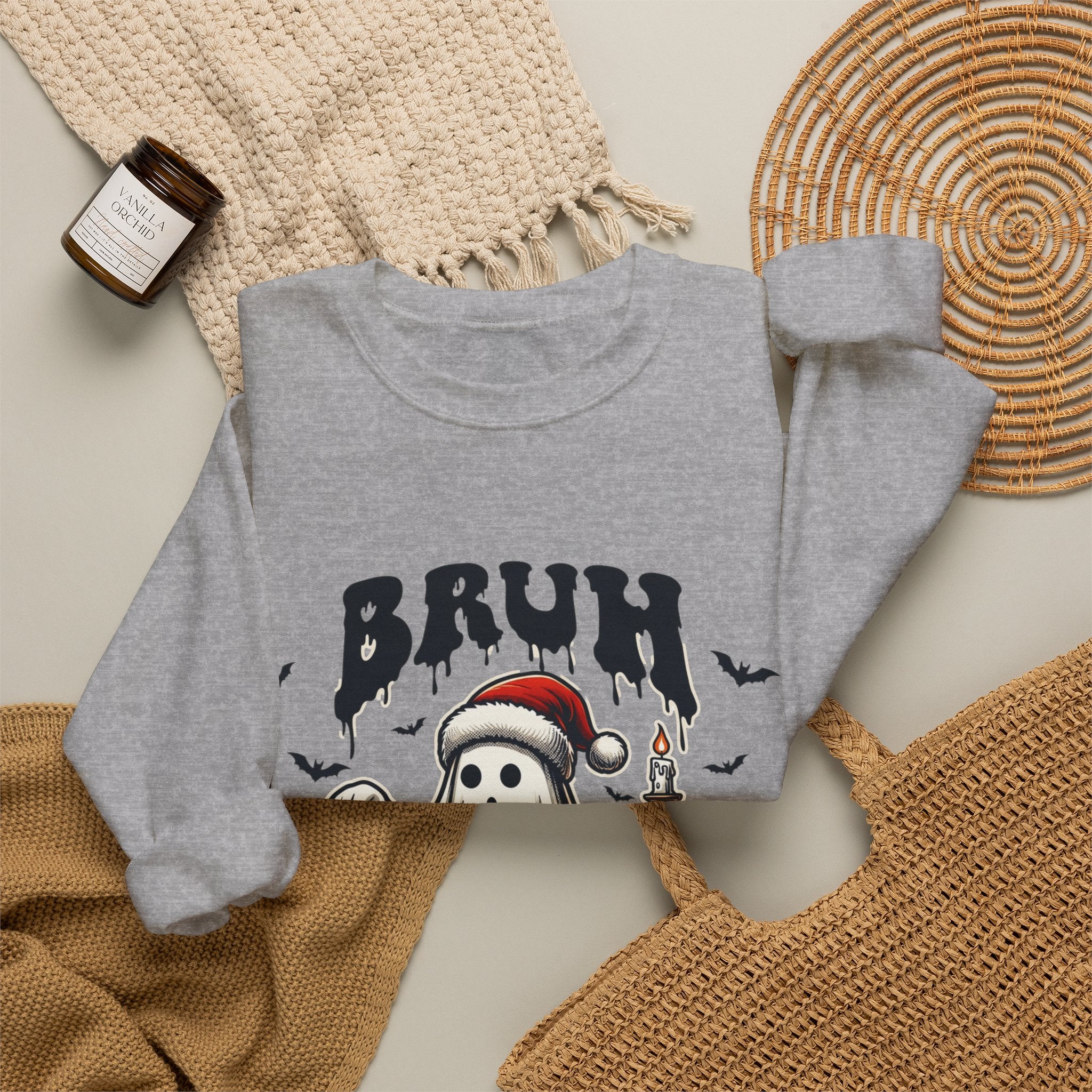 Sport Grey crewneck sweatshirt styled flat with a candle — ghost in a Santa hat