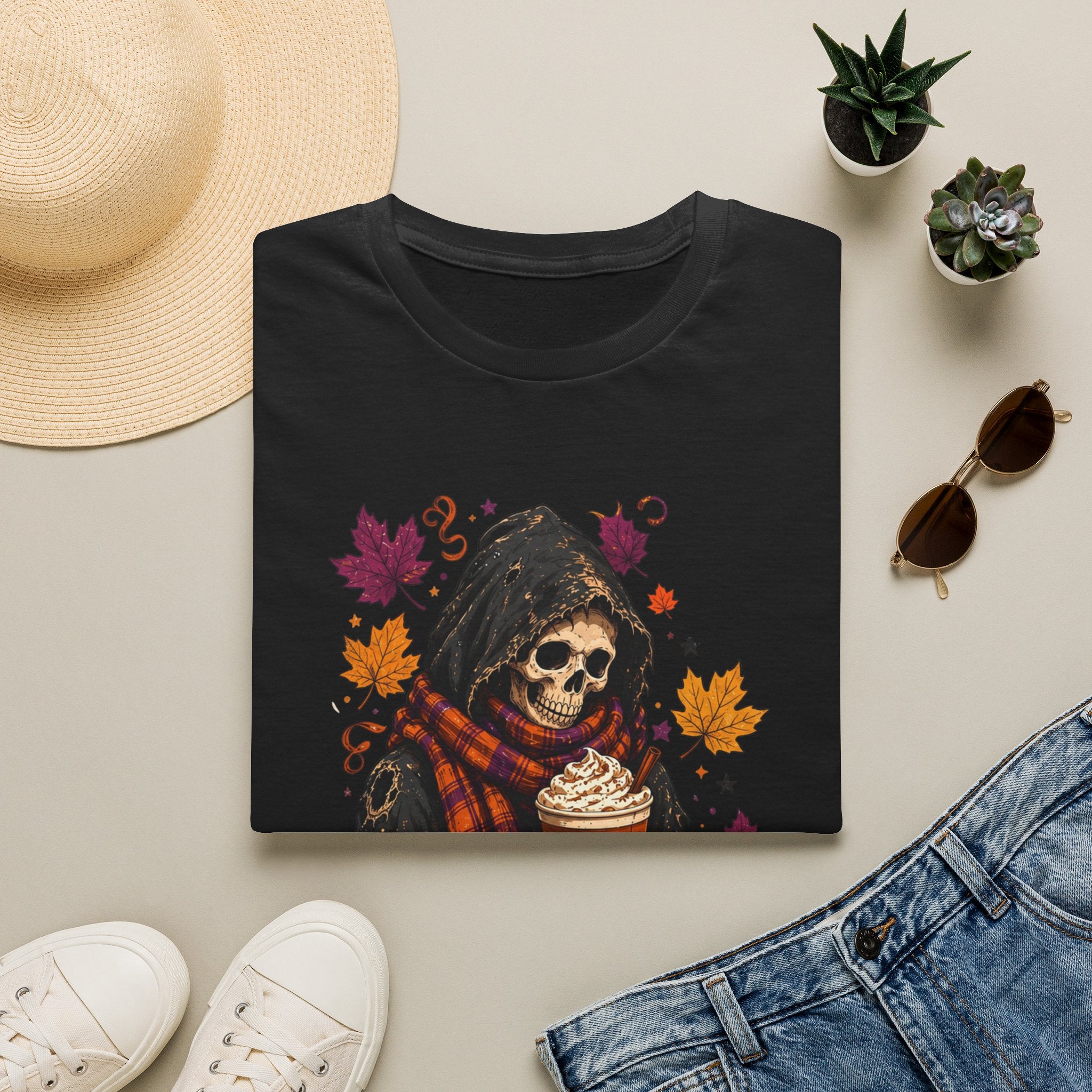 Black t-shirt styled flat with a candle — hooded reaper with pumpkin spice drink