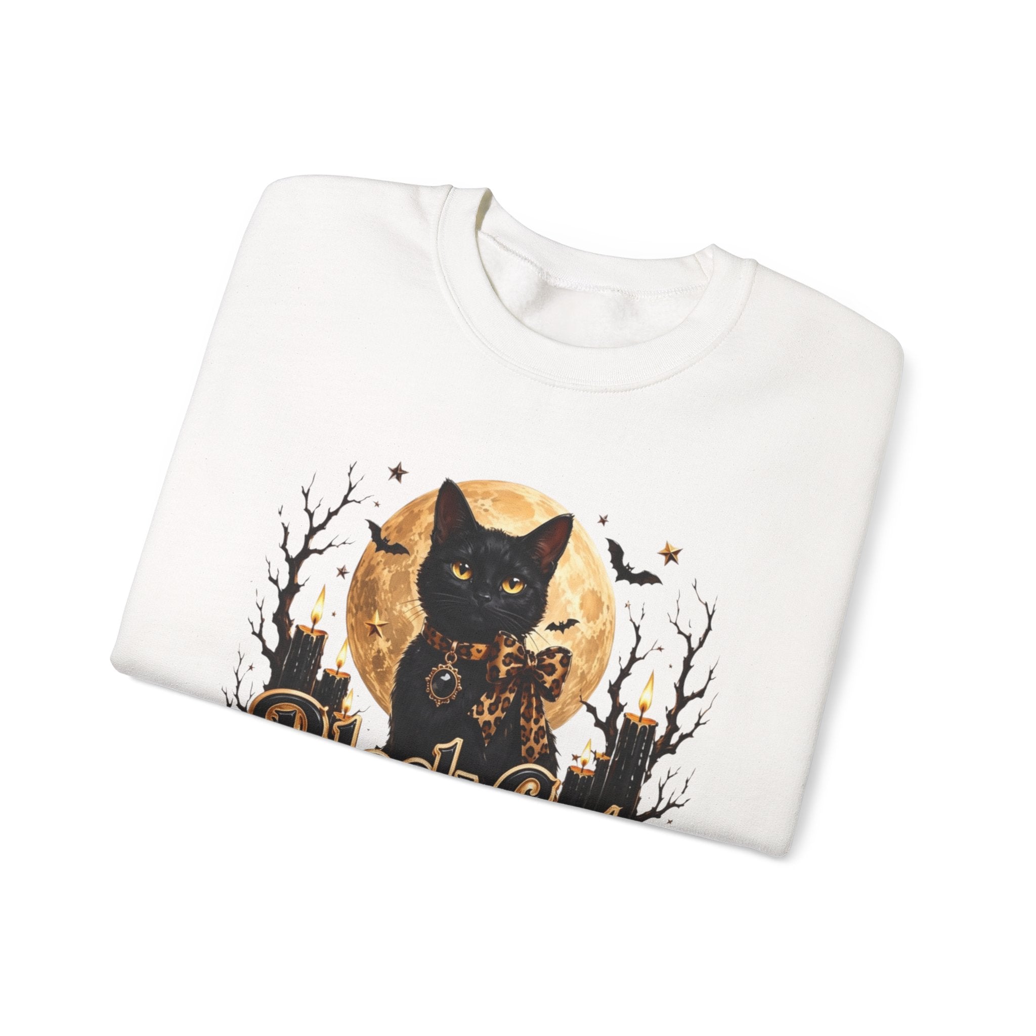 White crewneck sweatshirt folded to show the black cat sits before a glowing full moon print