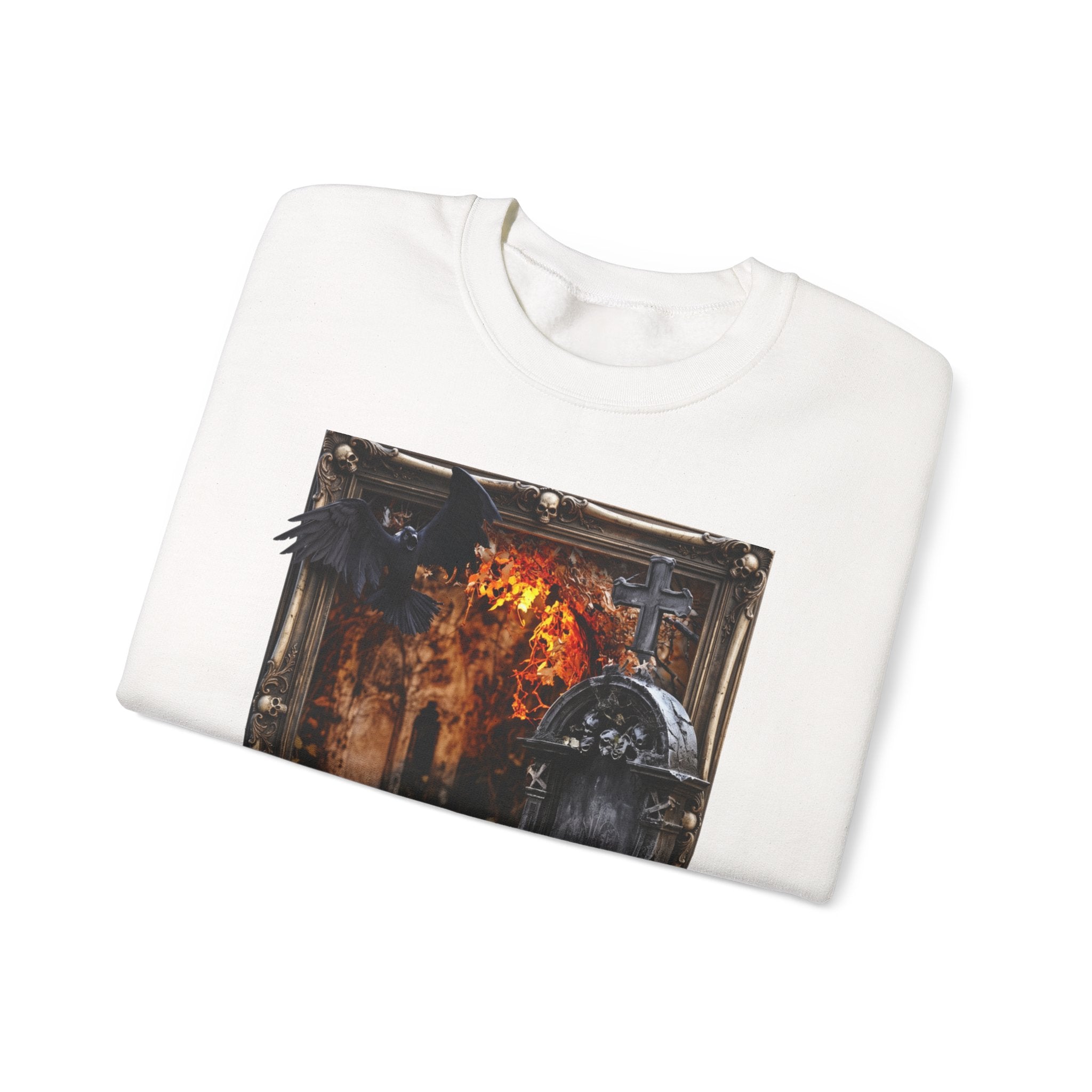 White crewneck sweatshirt folded to show the framed painterly scene of a stone tomb print