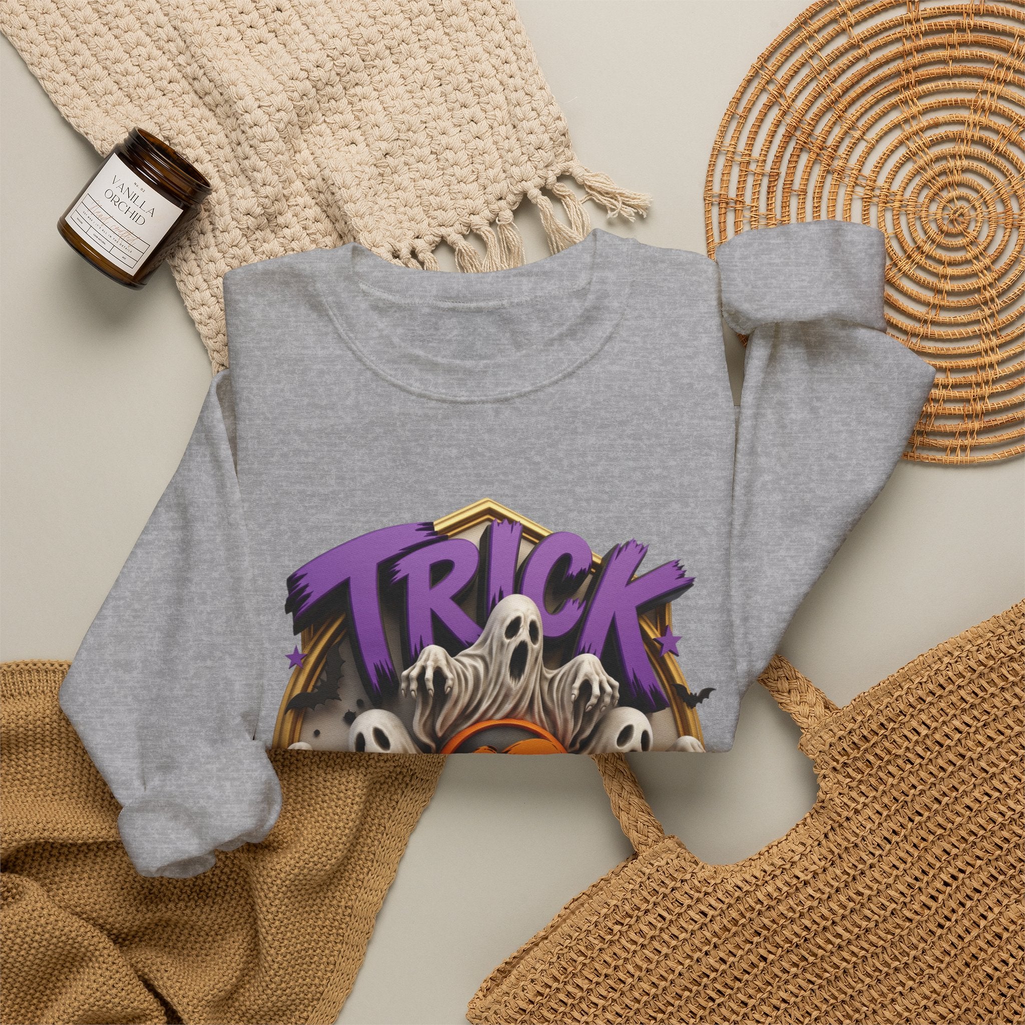 Sport Grey crewneck sweatshirt styled flat with a candle — ghosts huddled between carved pumpkins