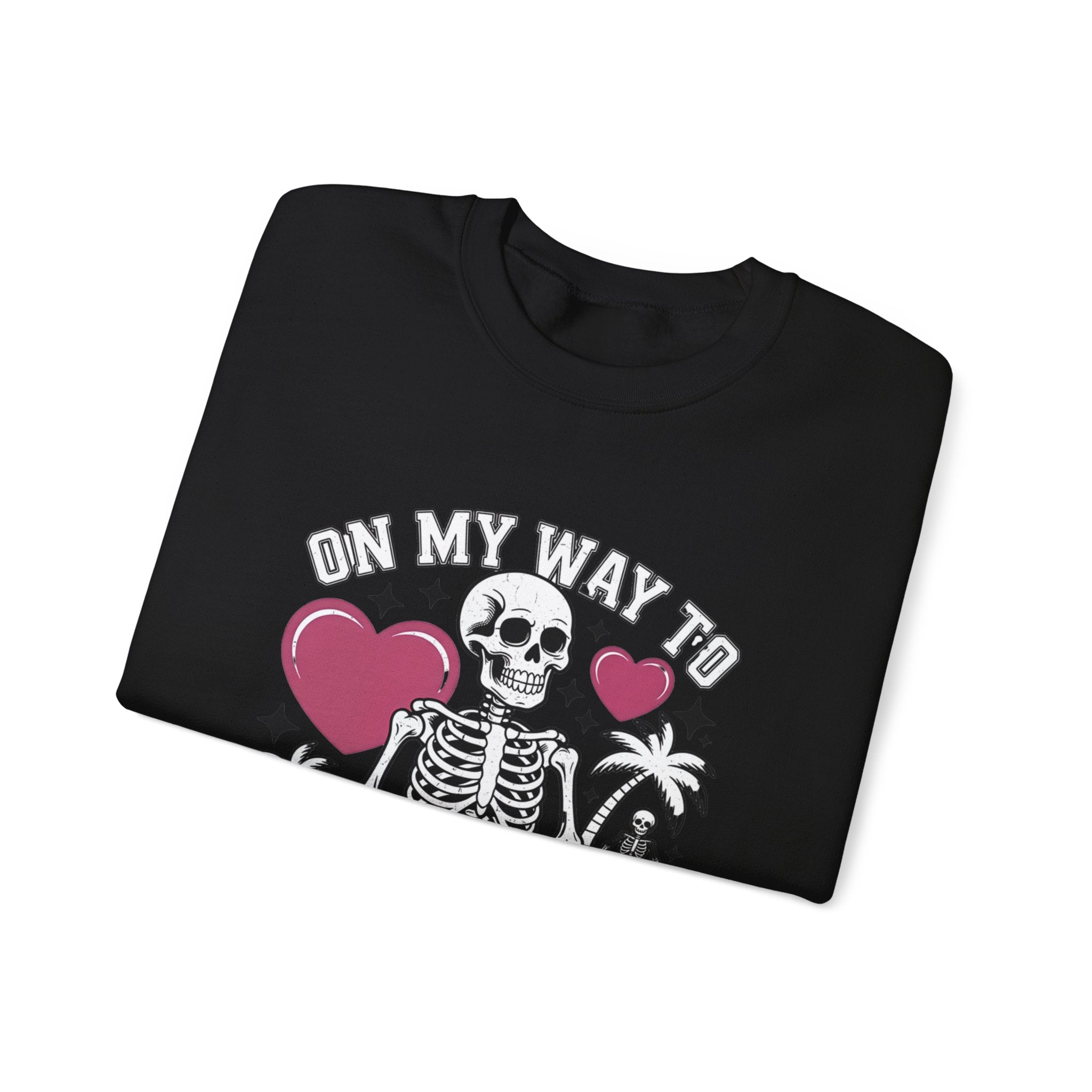 Black crewneck sweatshirt folded to show the two line drawn skeletons under pink hearts print