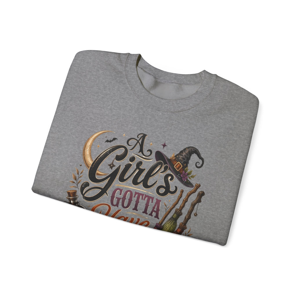 Graphite Heather crewneck sweatshirt folded to show the hand-lettered script reading a girl's gotta have options print
