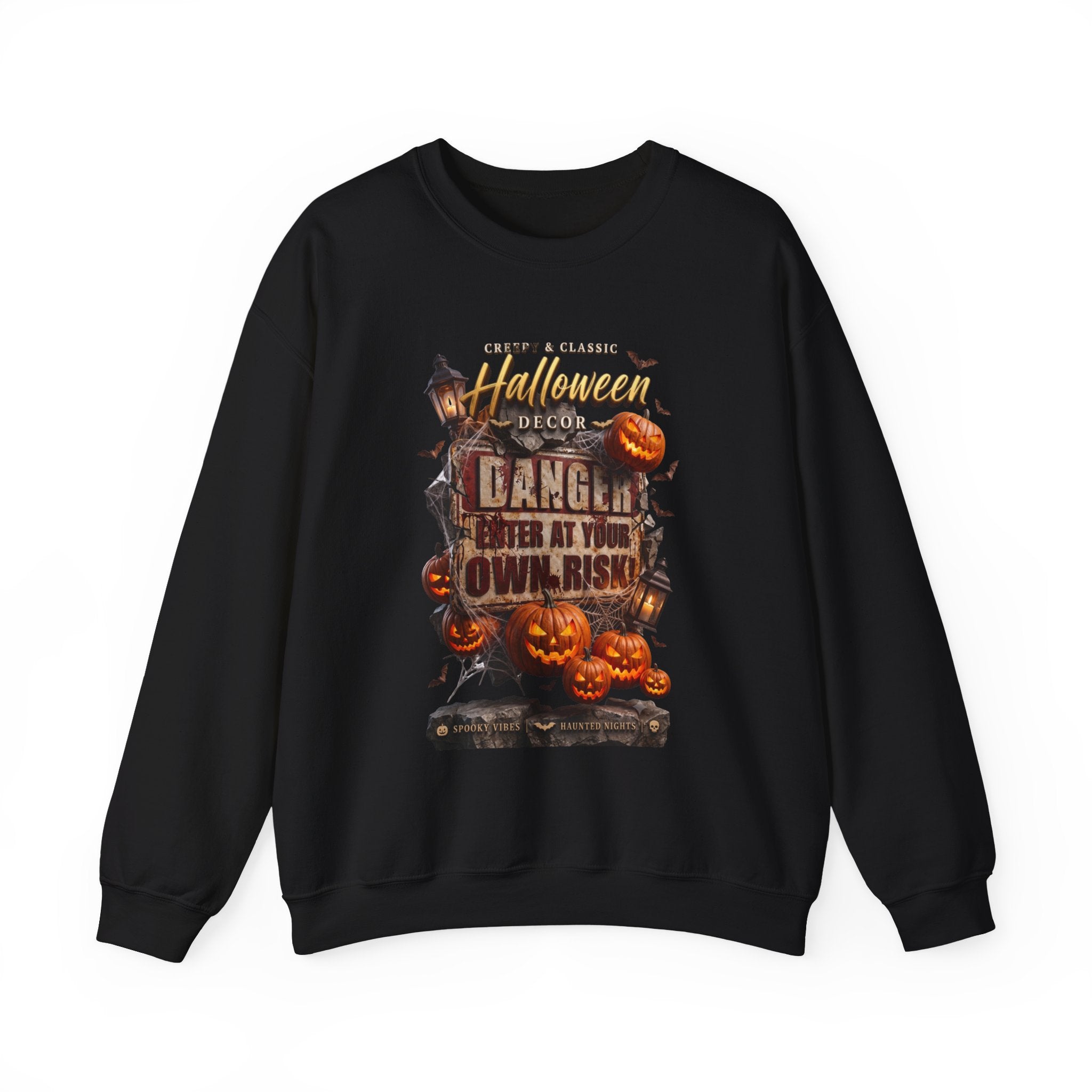 Black crewneck sweatshirt laid flat, printed with a aged danger sign hangs above a cluster of glowing