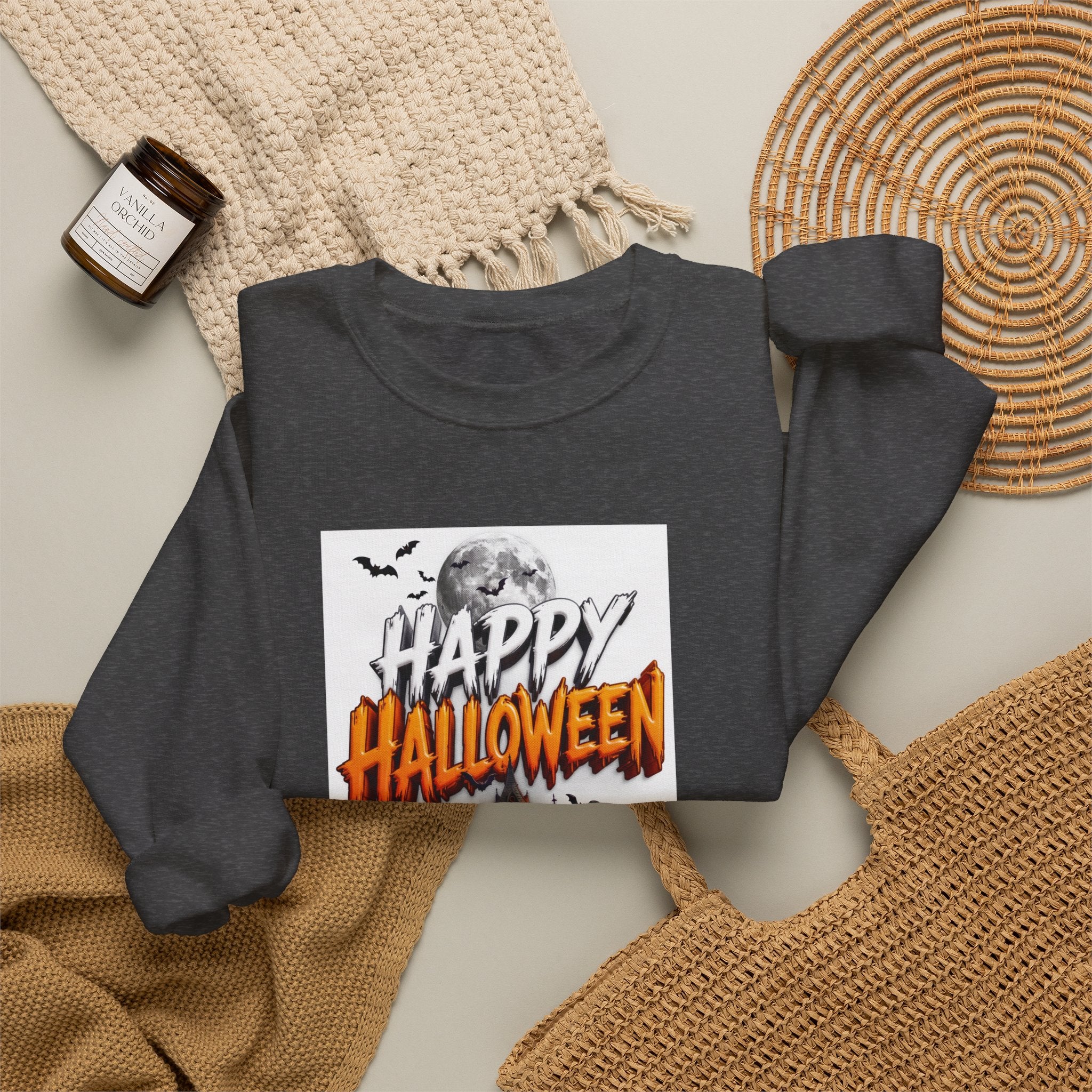 Dark Heather crewneck sweatshirt styled flat with a candle — haunted house with pumpkins and ghosts