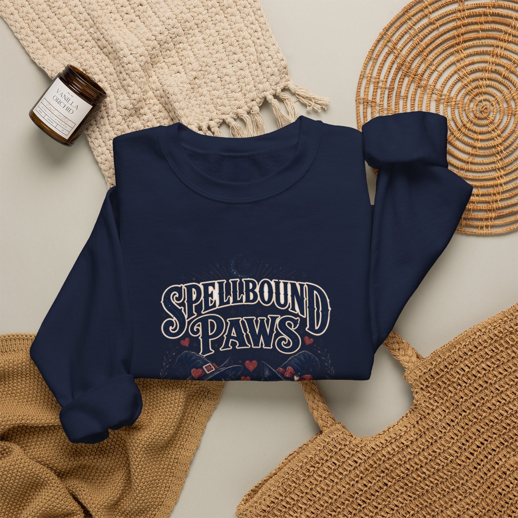 Navy crewneck sweatshirt styled flat with a candle — two black cats in witch hats