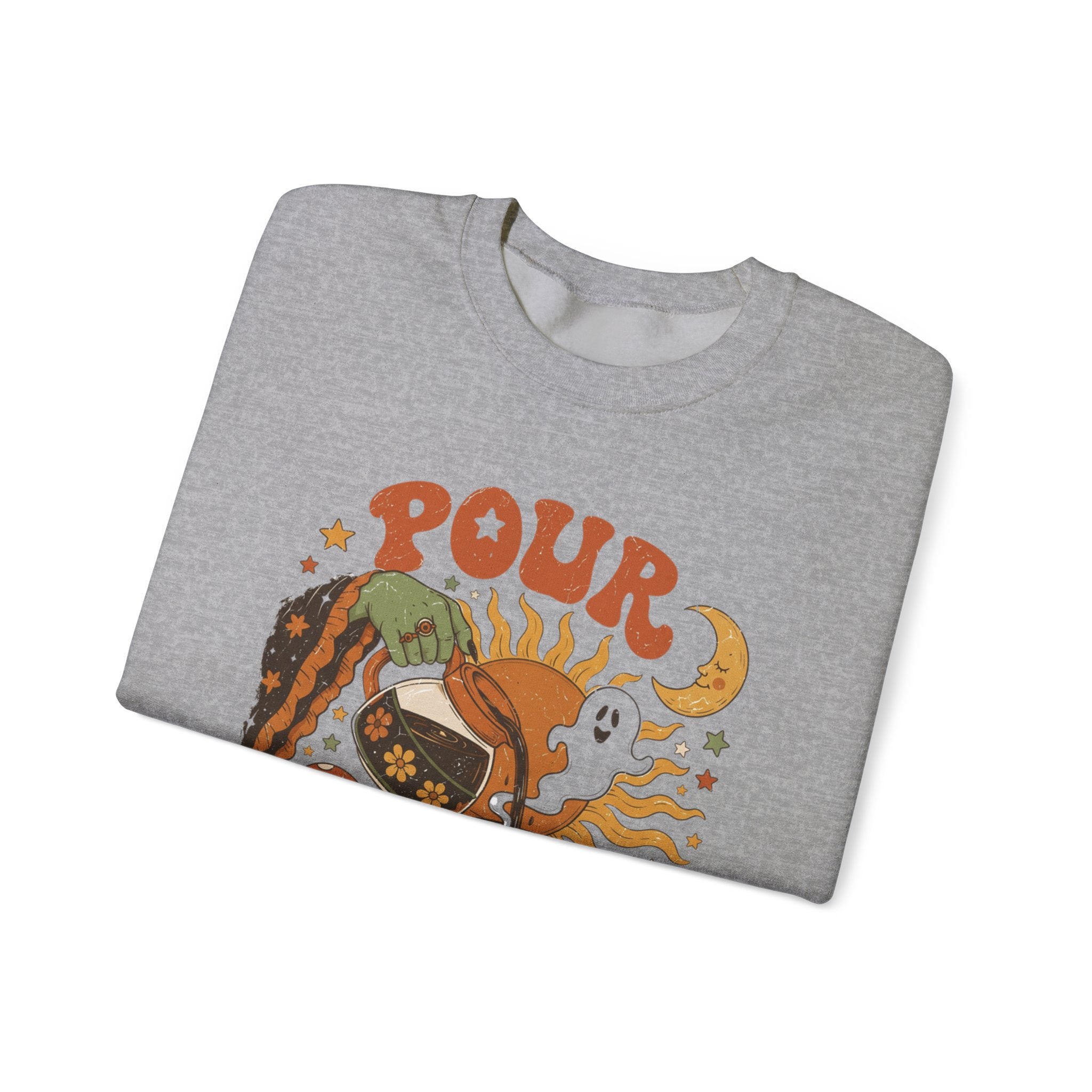 Sport Grey crewneck sweatshirt folded to show the green witch hand tipping a flower-patterned coffee pot into print