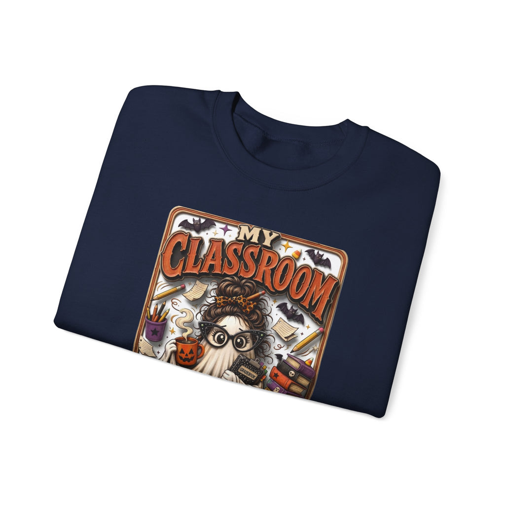 Navy crewneck sweatshirt folded to show the bespectacled ghost with a messy bun grades away among print