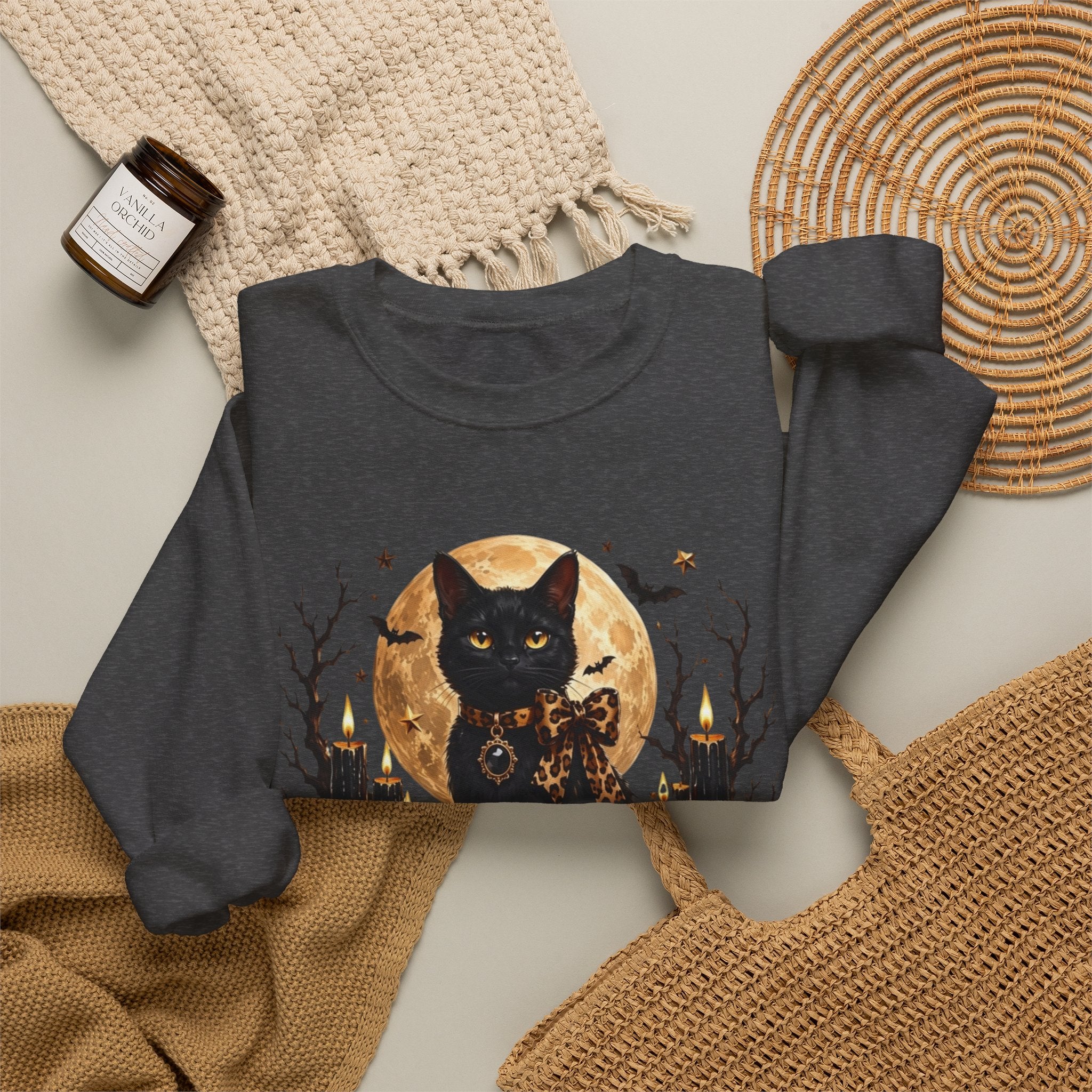 Dark Heather crewneck sweatshirt styled flat with a candle — black cat before a full moon