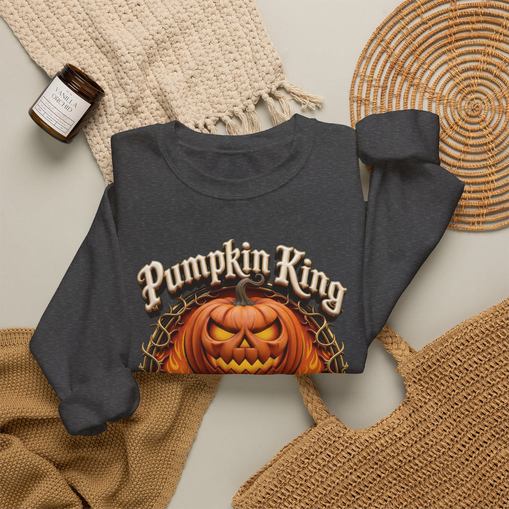 Dark Heather crewneck sweatshirt styled flat with a candle — two jack-o-lanterns in a thorny wreath