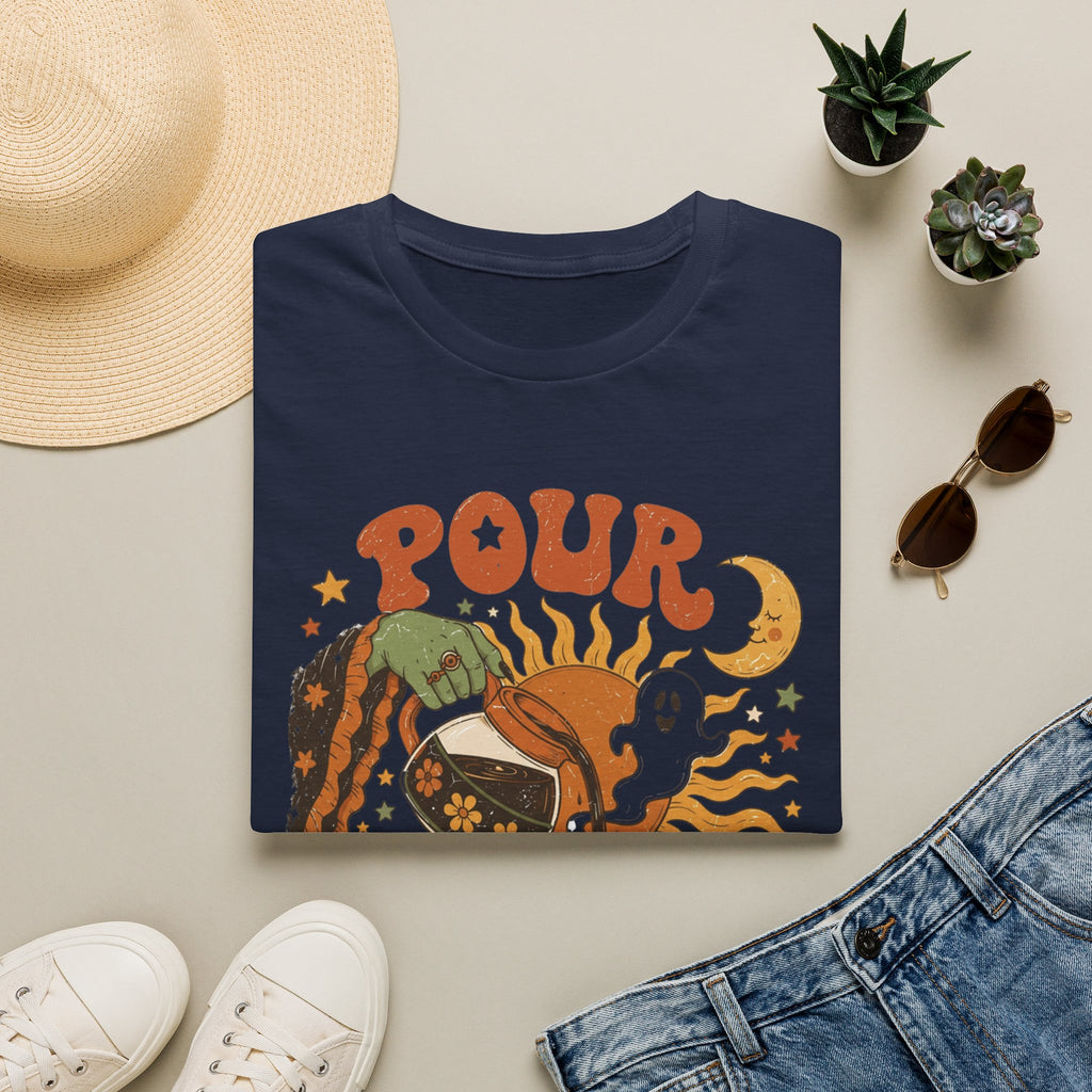 Navy t-shirt styled flat with a candle — green witch hand pouring coffee