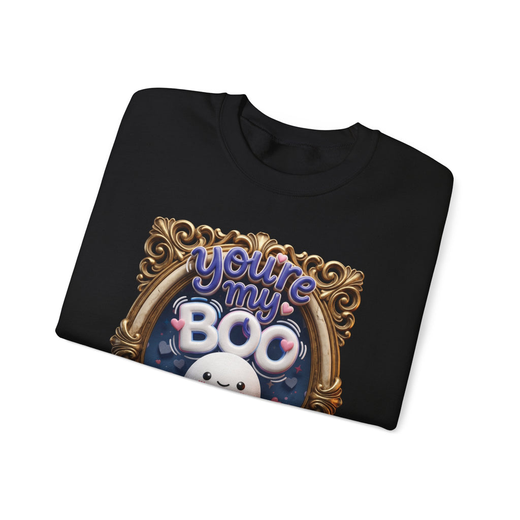 Black crewneck sweatshirt folded to show the round smiling ghost floats inside a gilded vintage frame print