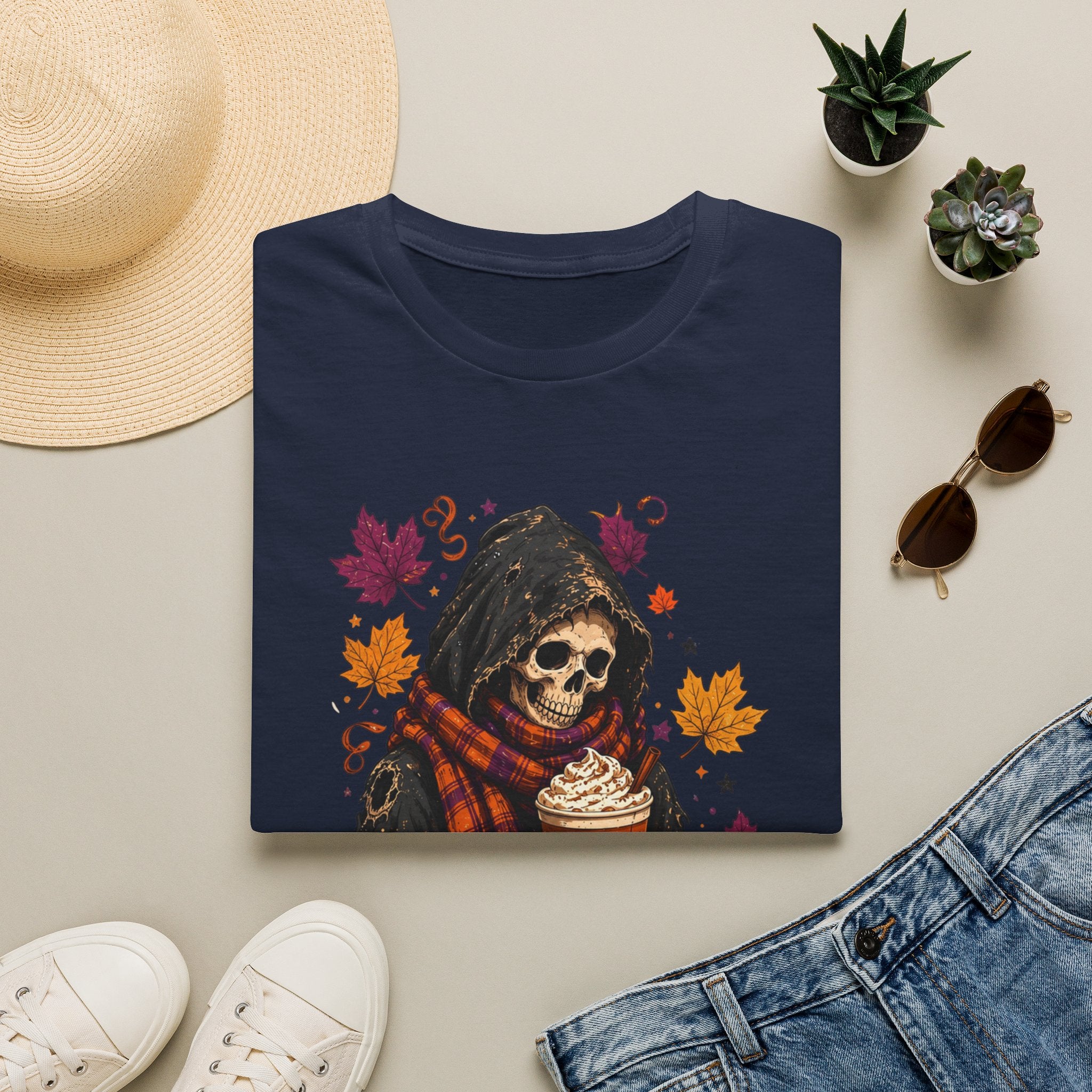 Navy t-shirt styled flat with a candle — hooded reaper with pumpkin spice drink