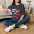 Dark Heather Grey t-shirt laid flat, printed with a stacked graffiti lettering in electric pinks