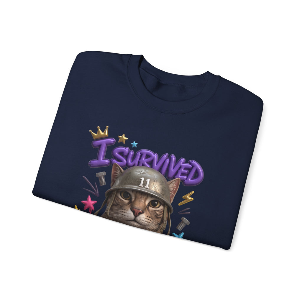 Navy crewneck sweatshirt folded to show the flat-eyed cat wearing a battered steel helmet print