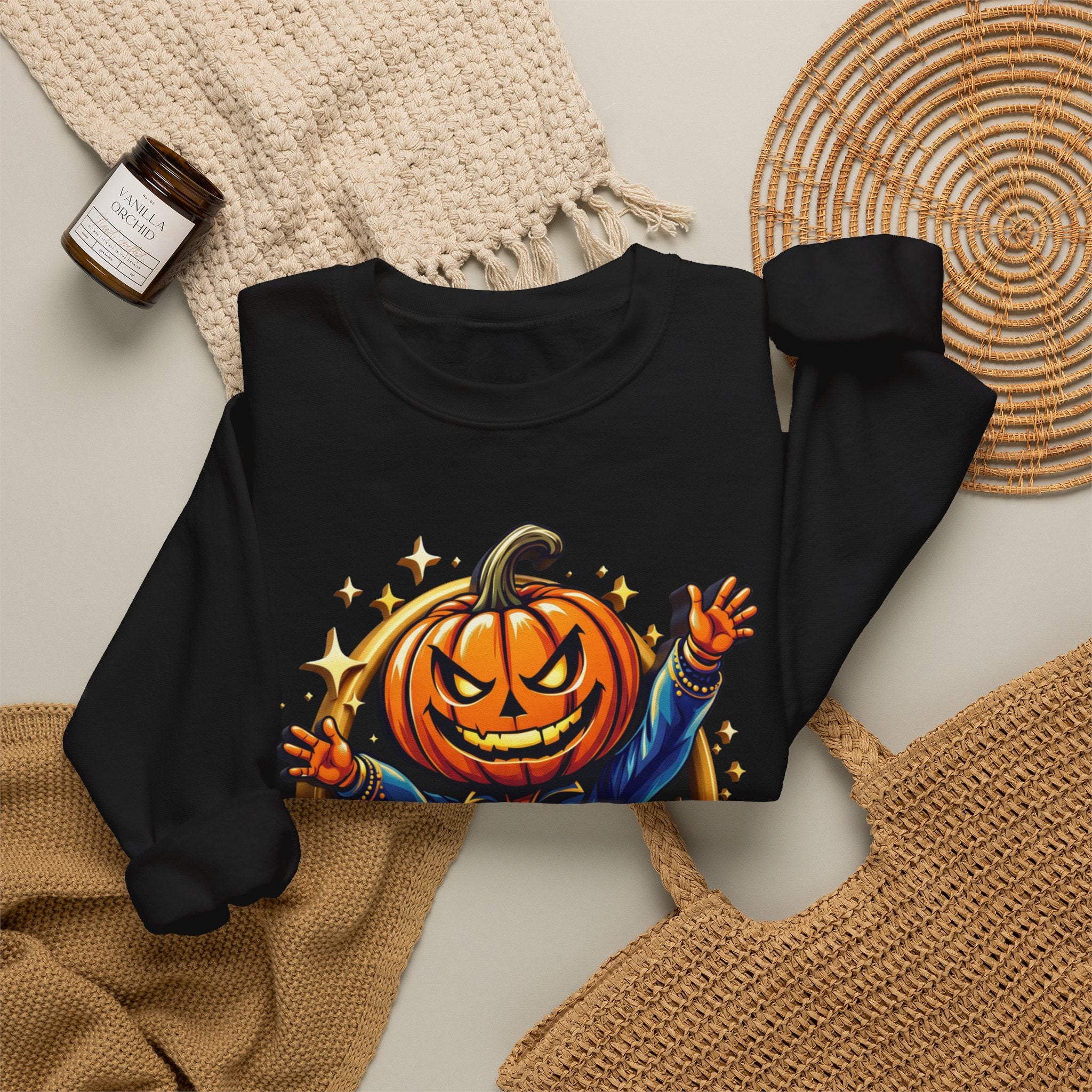 Black crewneck sweatshirt styled flat with a candle — jack-o-lantern head in a blue jacket
