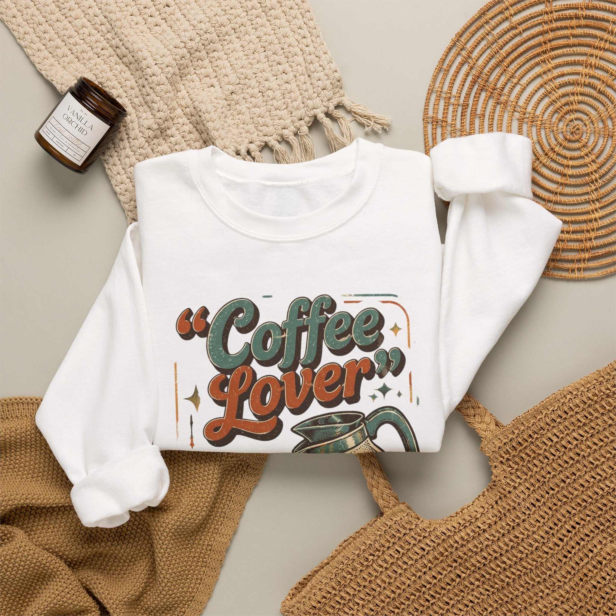 White crewneck sweatshirt styled flat with a candle — retro coffee pot