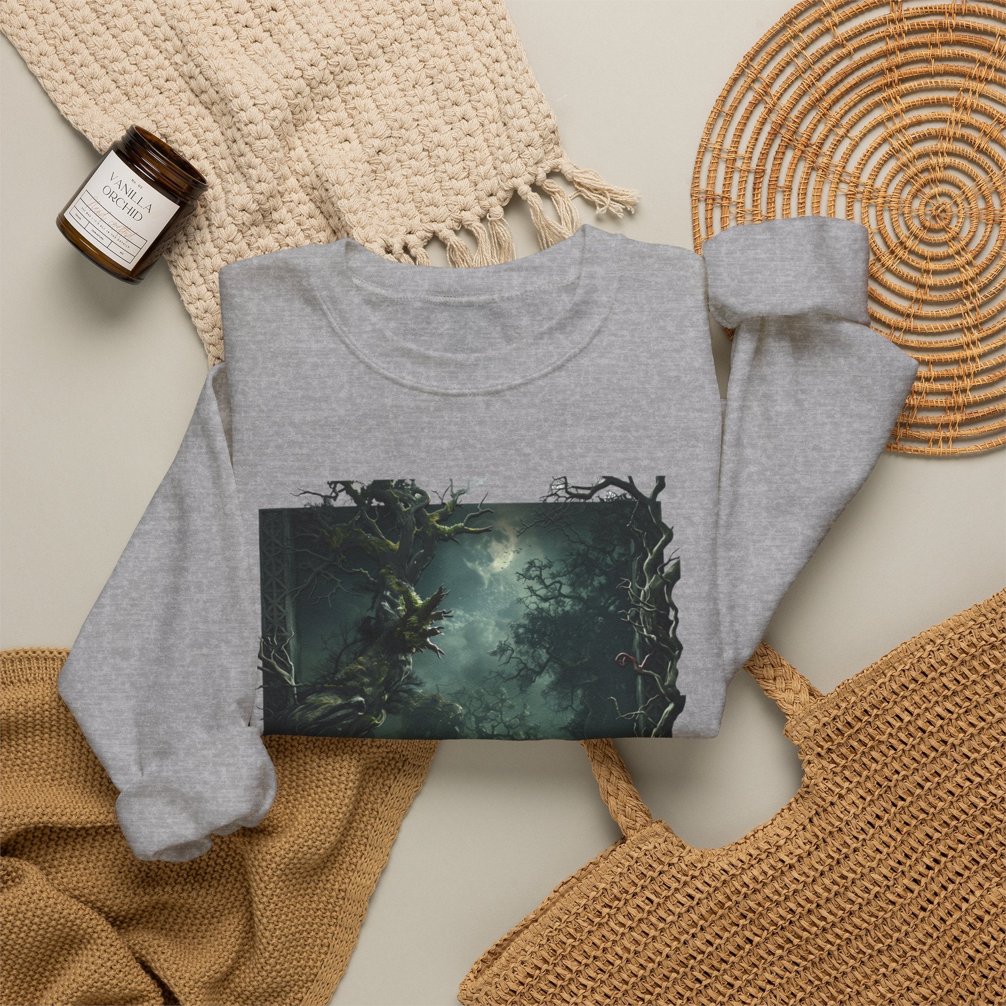 Sport Grey crewneck sweatshirt styled flat with a candle — moonlit forest of gnarled mossy trees