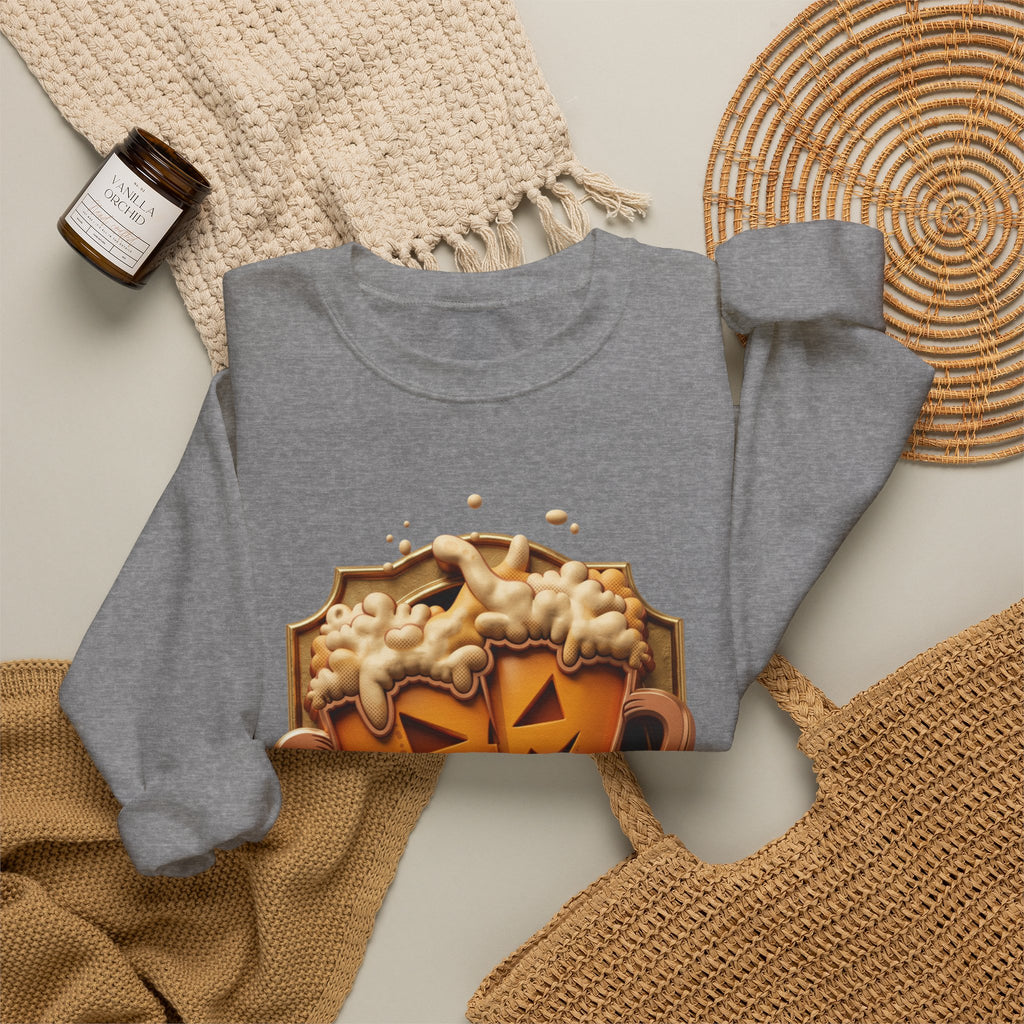 Graphite Heather crewneck sweatshirt styled flat with a candle — beer mugs carved as jack-o-lanterns