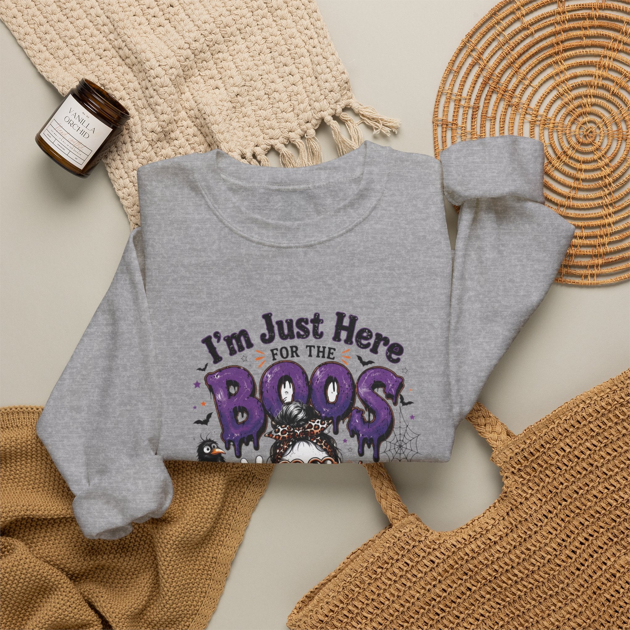 Sport Grey crewneck sweatshirt styled flat with a candle — three cartoon ghosts in sunglasses