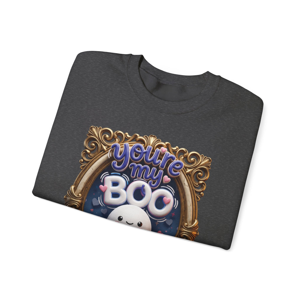 Dark Heather crewneck sweatshirt folded to show the round smiling ghost floats inside a gilded vintage frame print