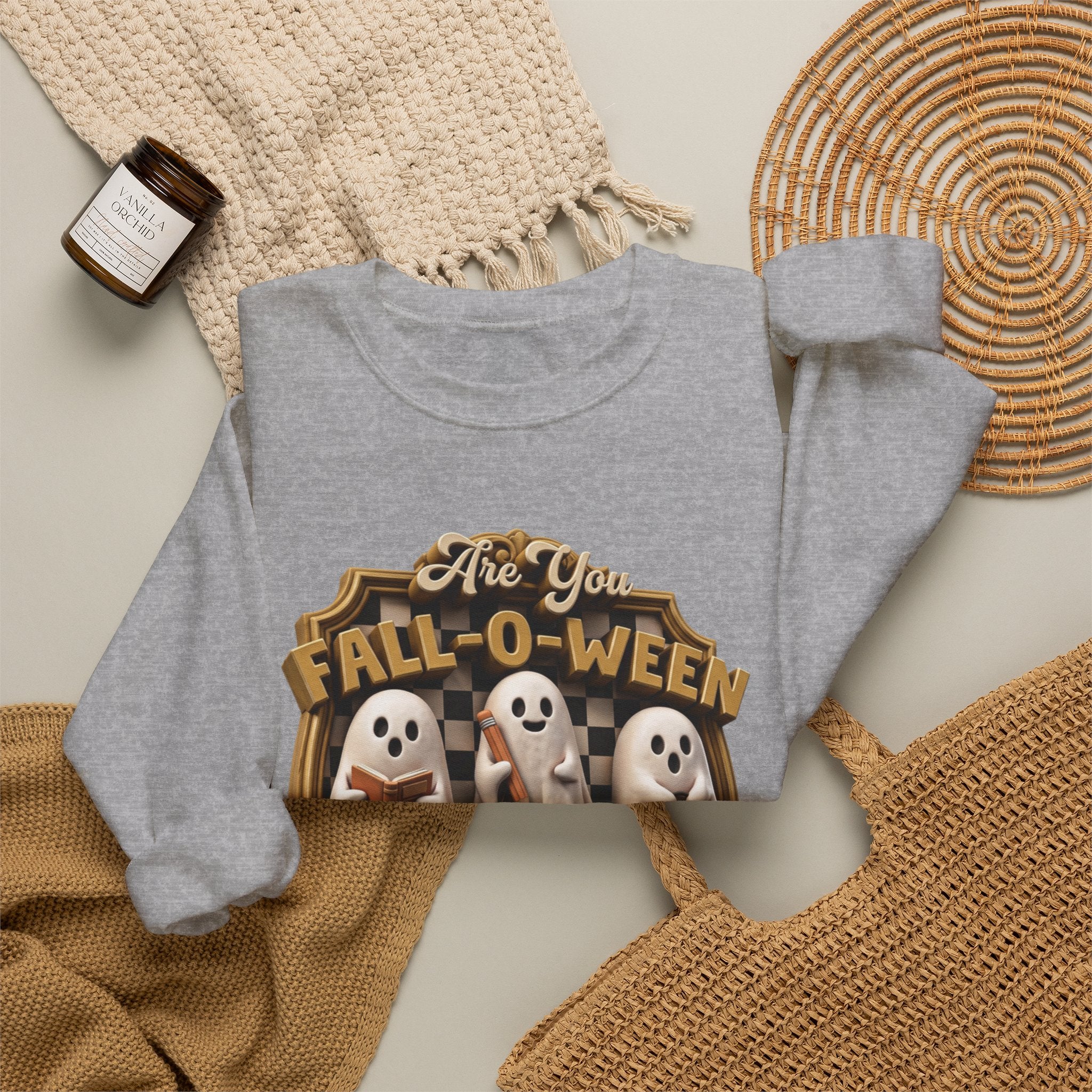 Sport Grey crewneck sweatshirt styled flat with a candle — three sheet ghosts reading a book