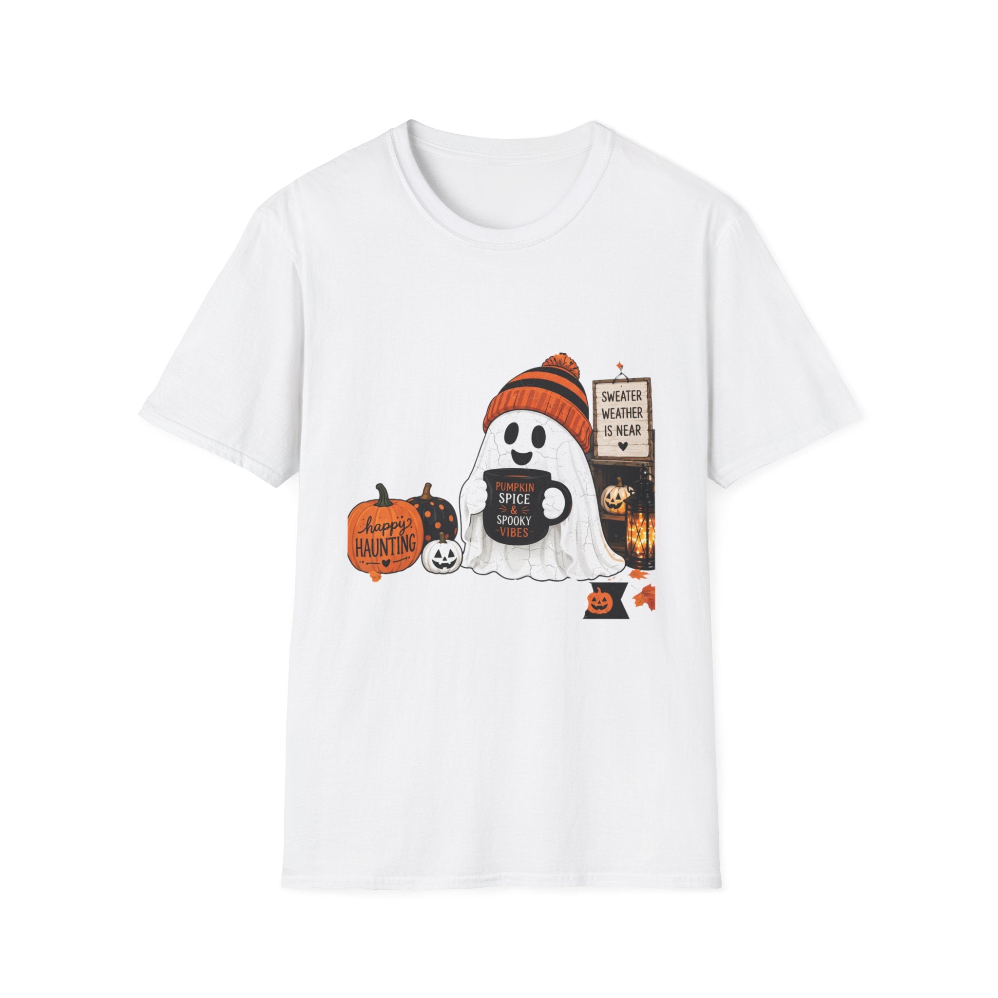 White t-shirt laid flat, printed with a small ghost in a knitted beanie holding a hand-painted