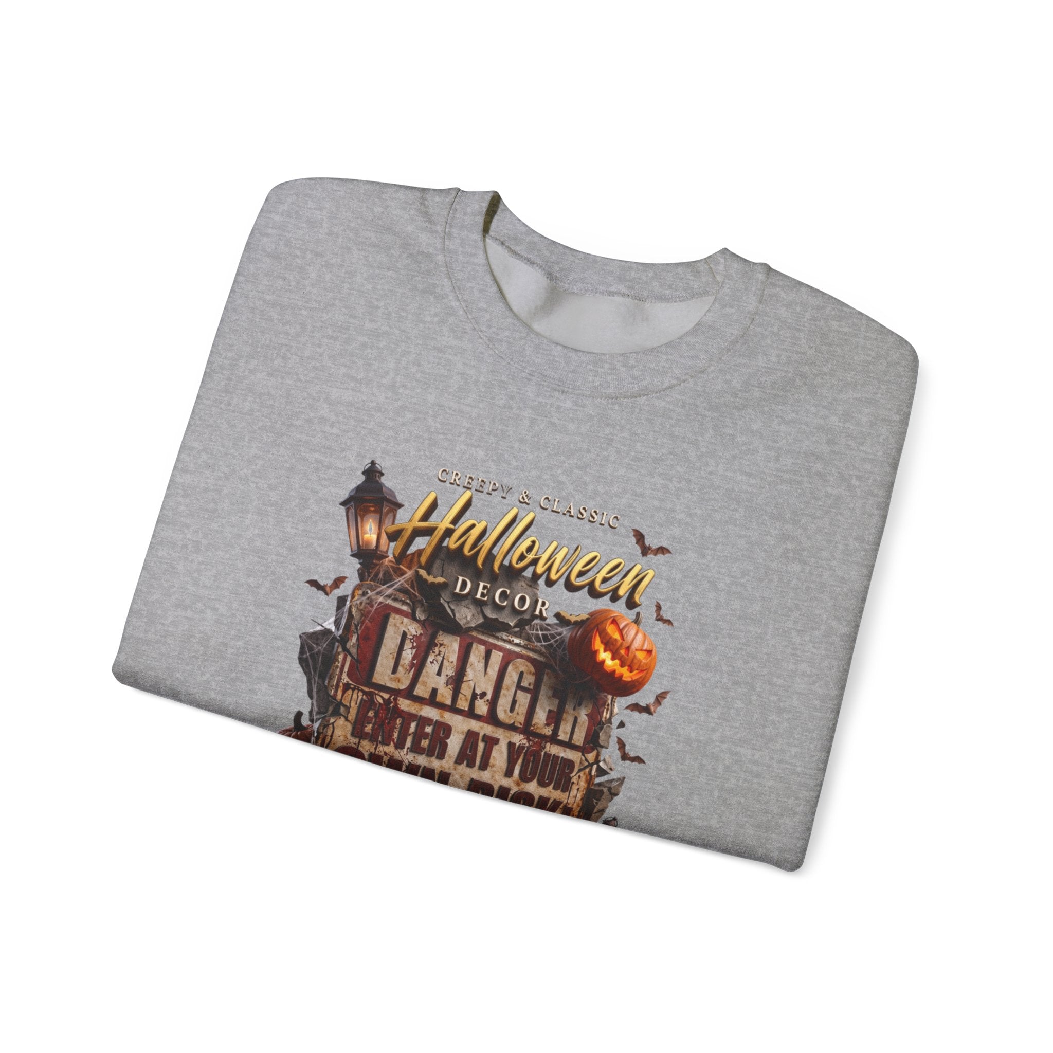 Sport Grey crewneck sweatshirt folded to show the aged danger sign hangs above a cluster of glowing print