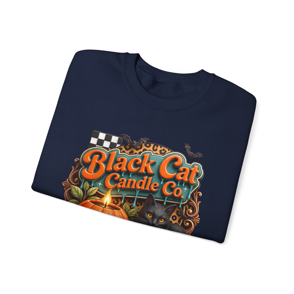 Navy crewneck sweatshirt folded to show the retro teal signboard reads black cat candle co print