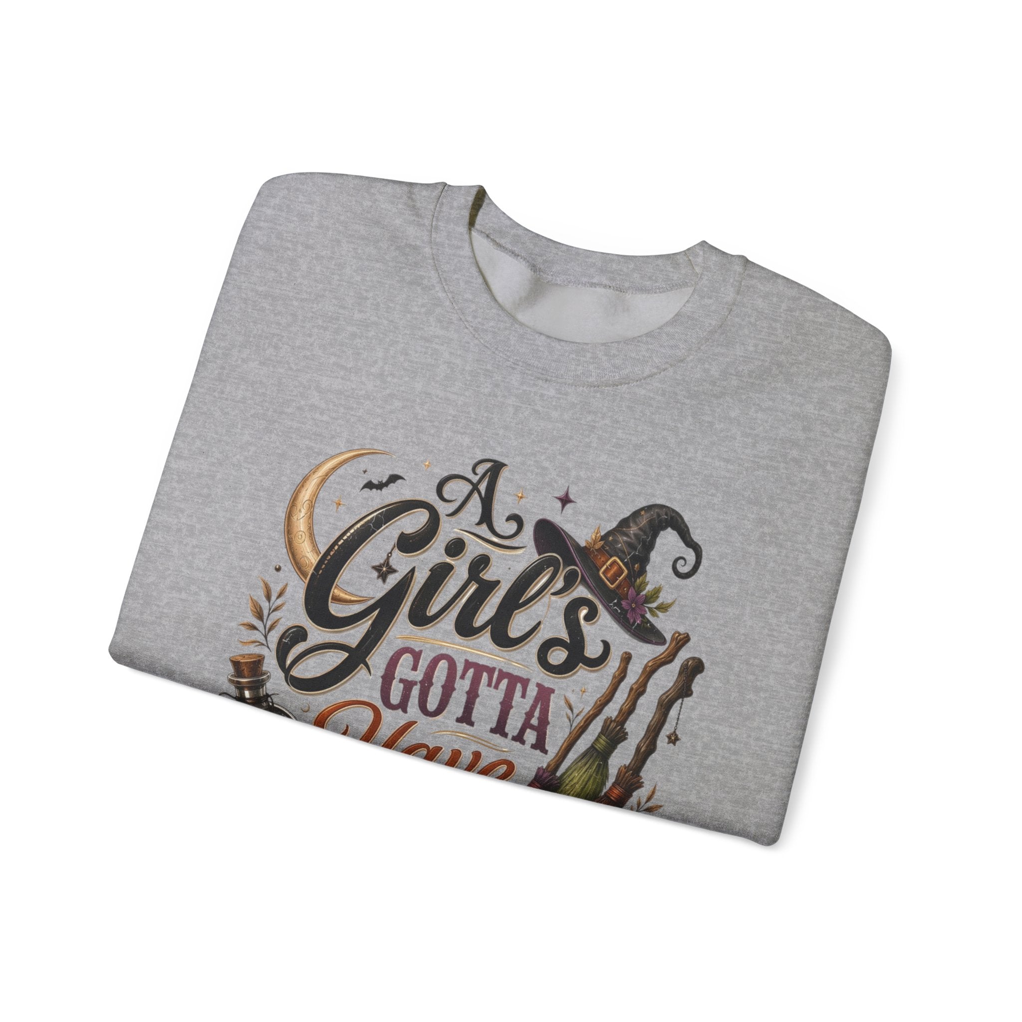 Sport Grey crewneck sweatshirt folded to show the hand-lettered script reading a girl's gotta have options print