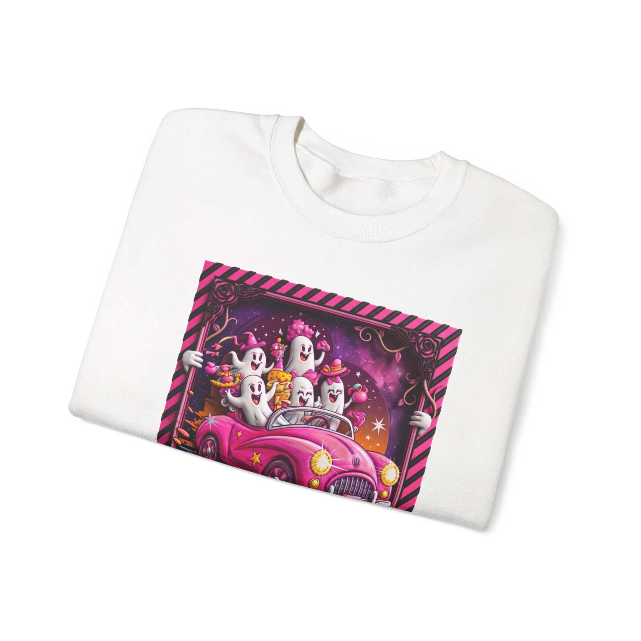 White crewneck sweatshirt folded to show the carload of smiling ghosts cruises in a bubblegum pink print