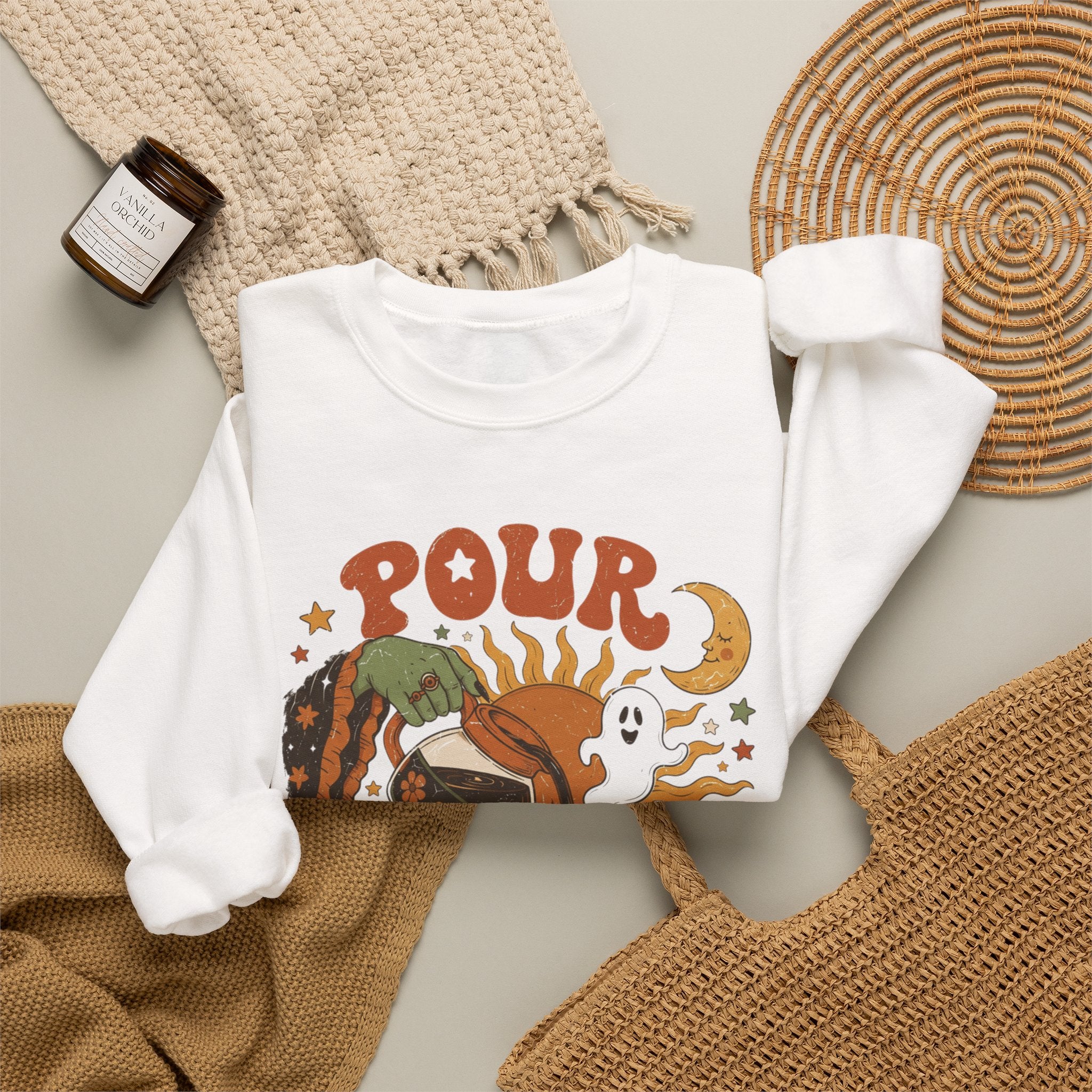 White crewneck sweatshirt styled flat with a candle — green witch hand pouring coffee