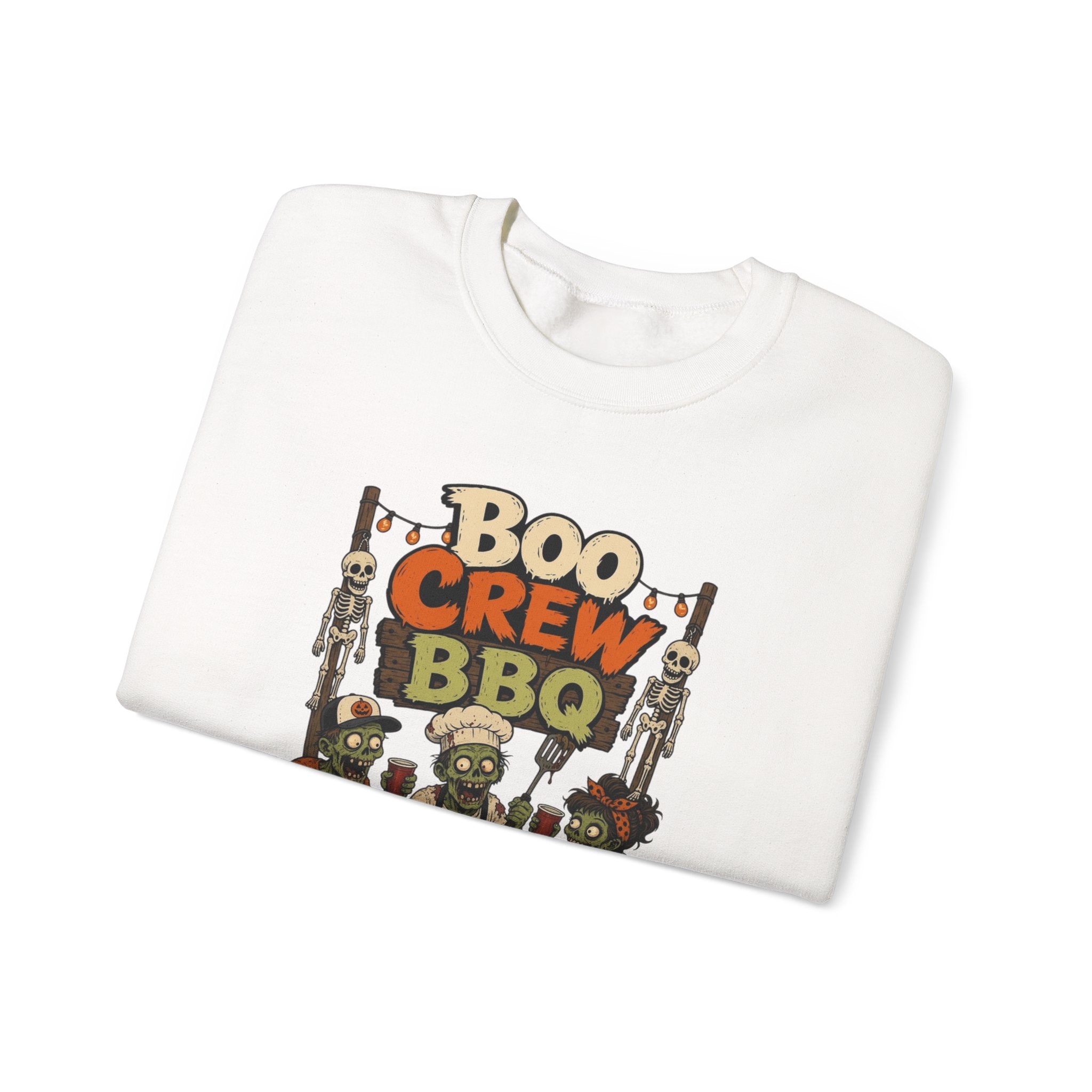 White crewneck sweatshirt folded to show the skeletons and zombies working the grill under a hand-painted print