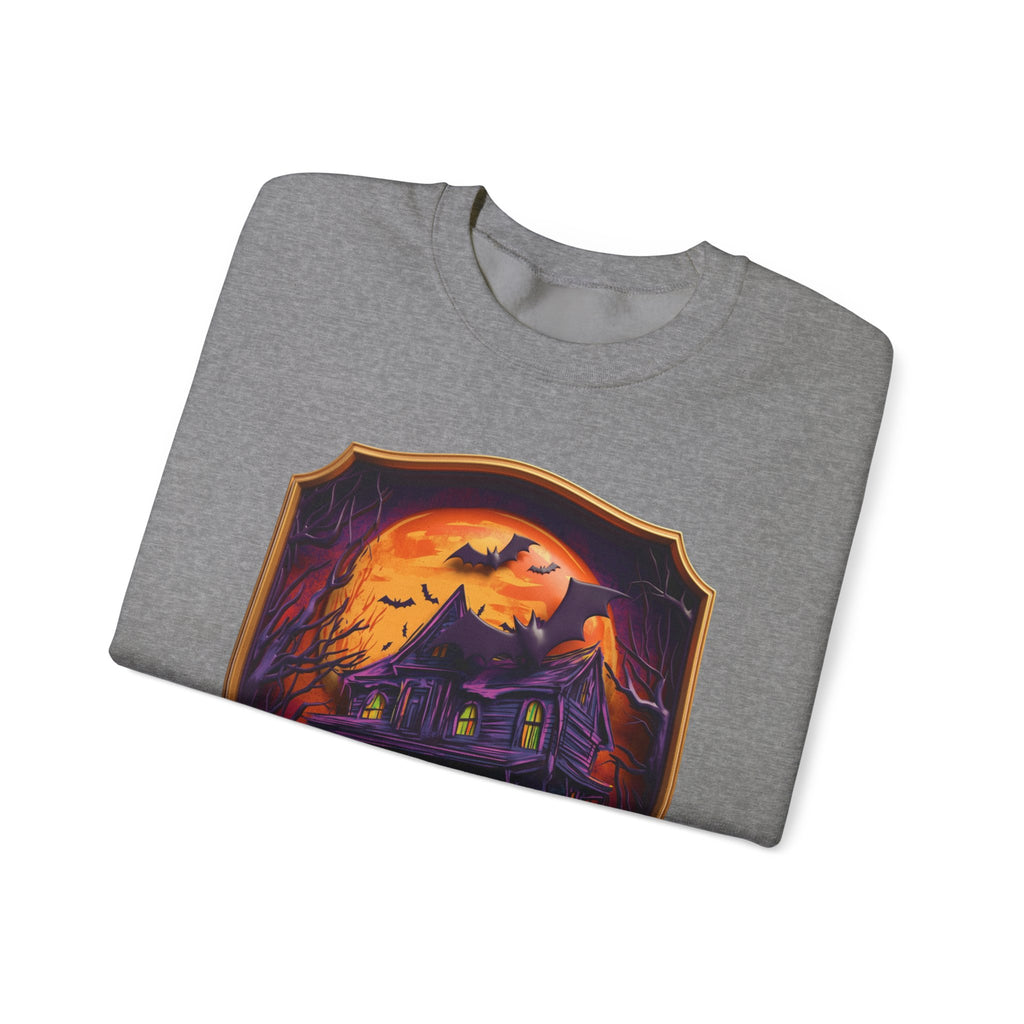 Graphite Heather crewneck sweatshirt folded to show the purple haunted mansion sits under a blazing orange moon print