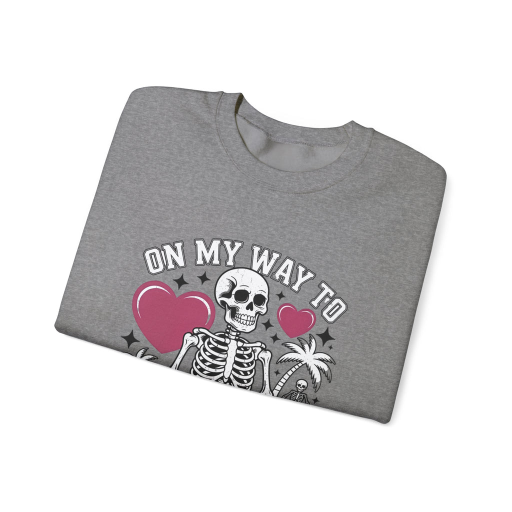 Graphite Heather crewneck sweatshirt folded to show the two line drawn skeletons under pink hearts print