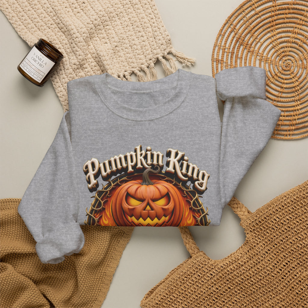 Sport Grey crewneck sweatshirt styled flat with a candle — two jack-o-lanterns in a thorny wreath