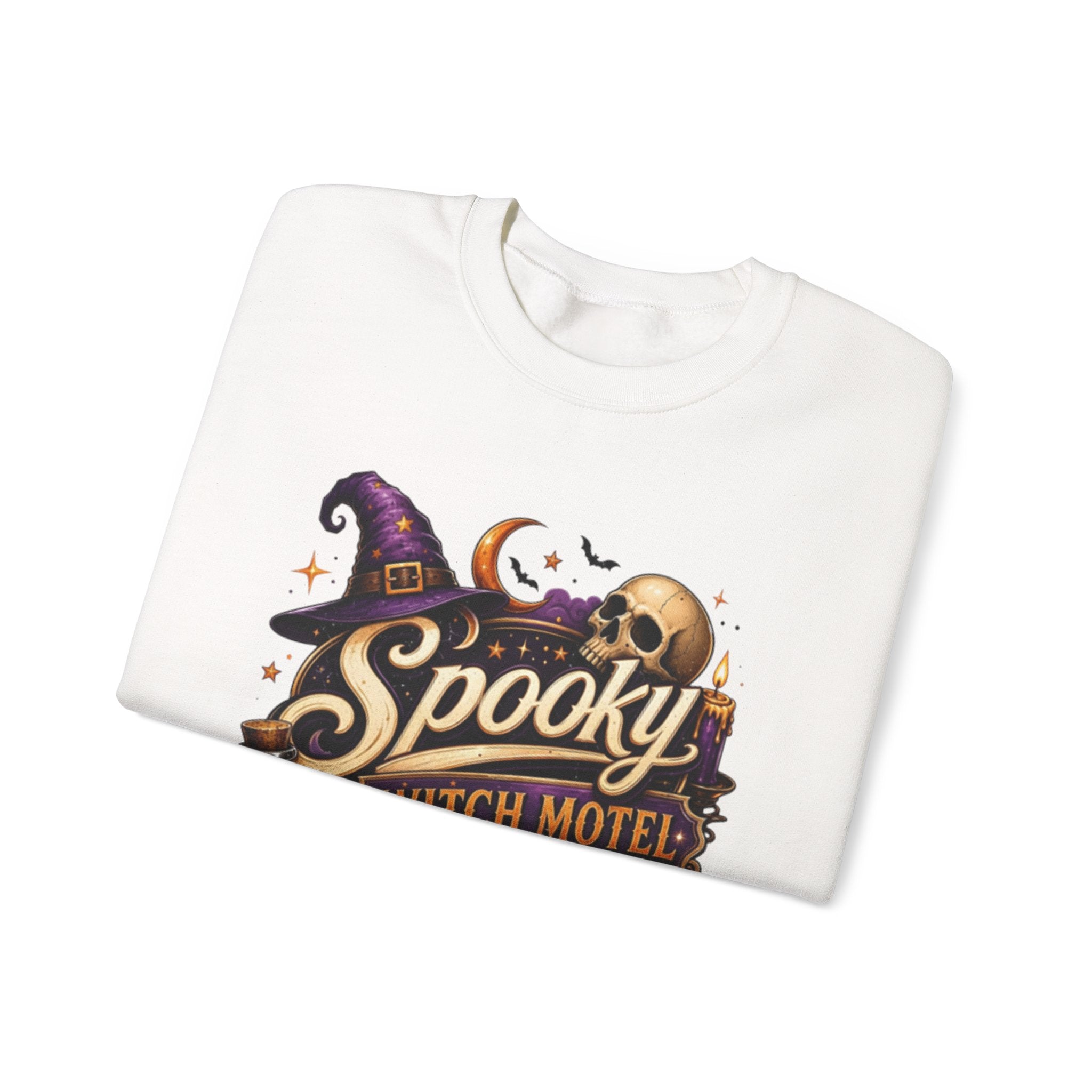 White crewneck sweatshirt folded to show the neon vintage motel sign reading spooky witch motel print