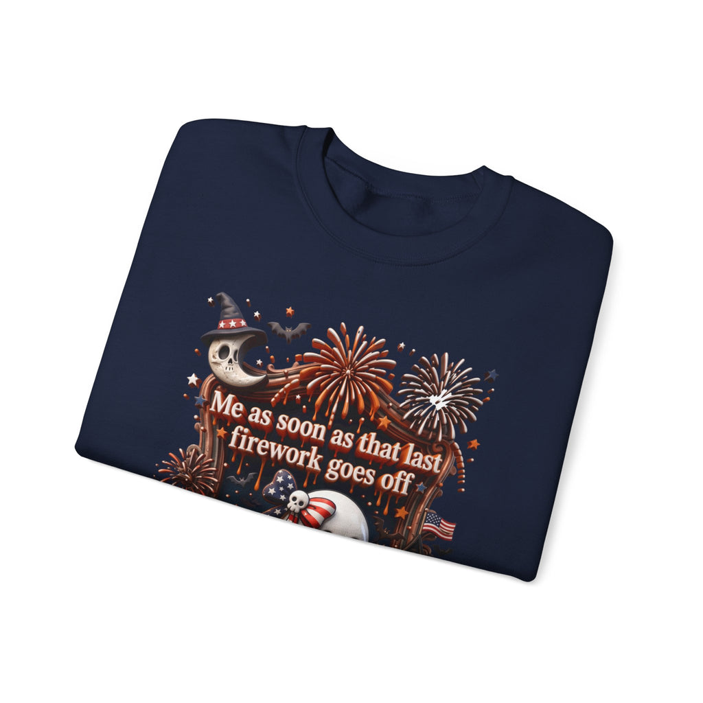 Navy crewneck sweatshirt folded to show the wide-eyed ghost clutches a striped firework print