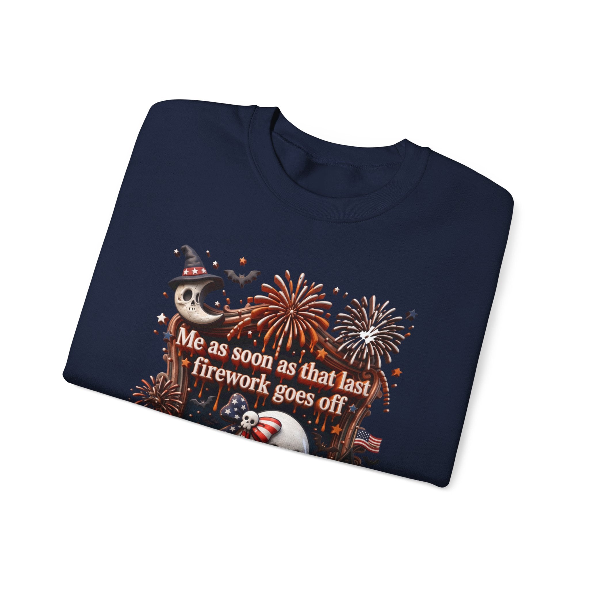 Navy crewneck sweatshirt folded to show the wide-eyed ghost clutches a striped firework print