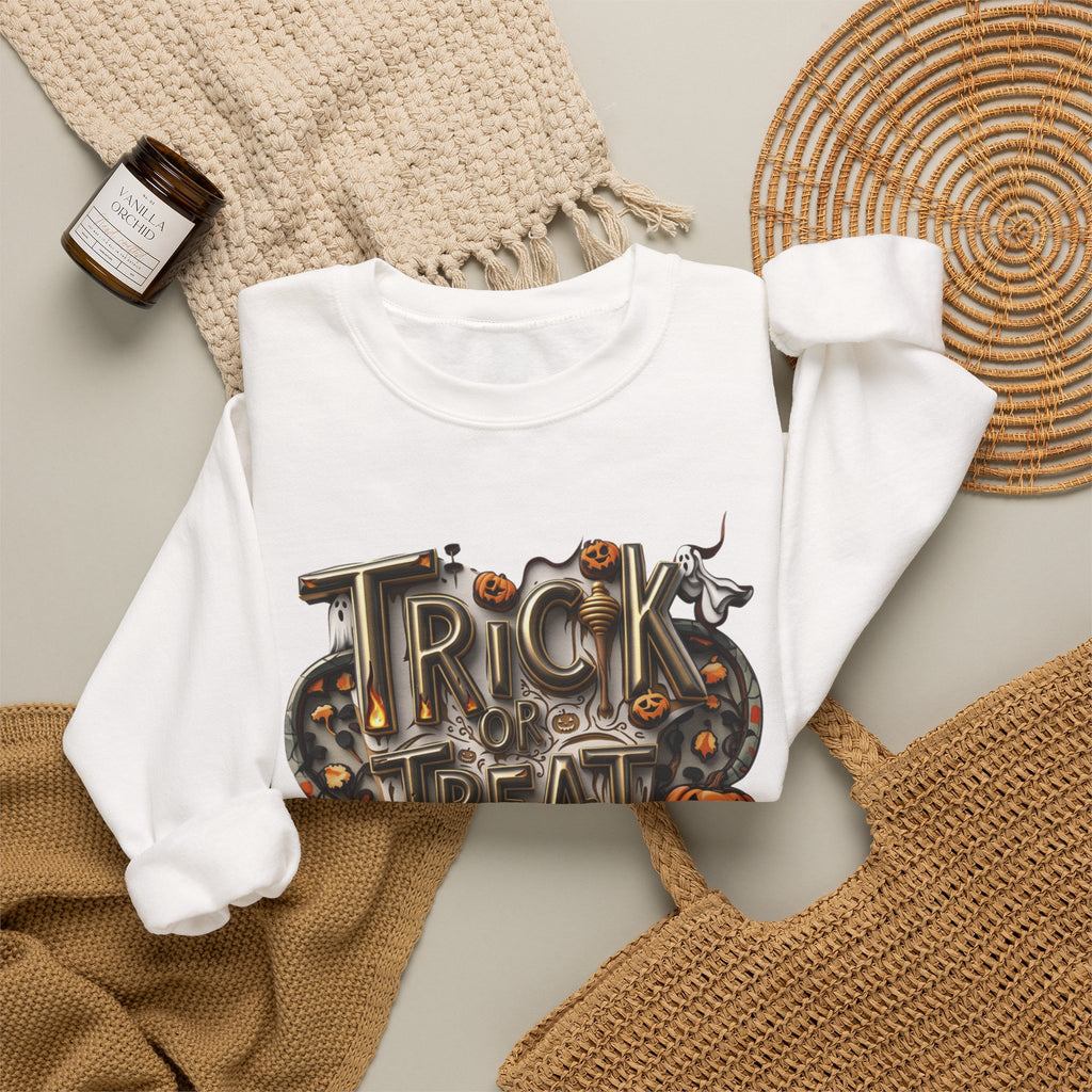 White crewneck sweatshirt styled flat with a candle — carved Trick or Treat Yourself lettering