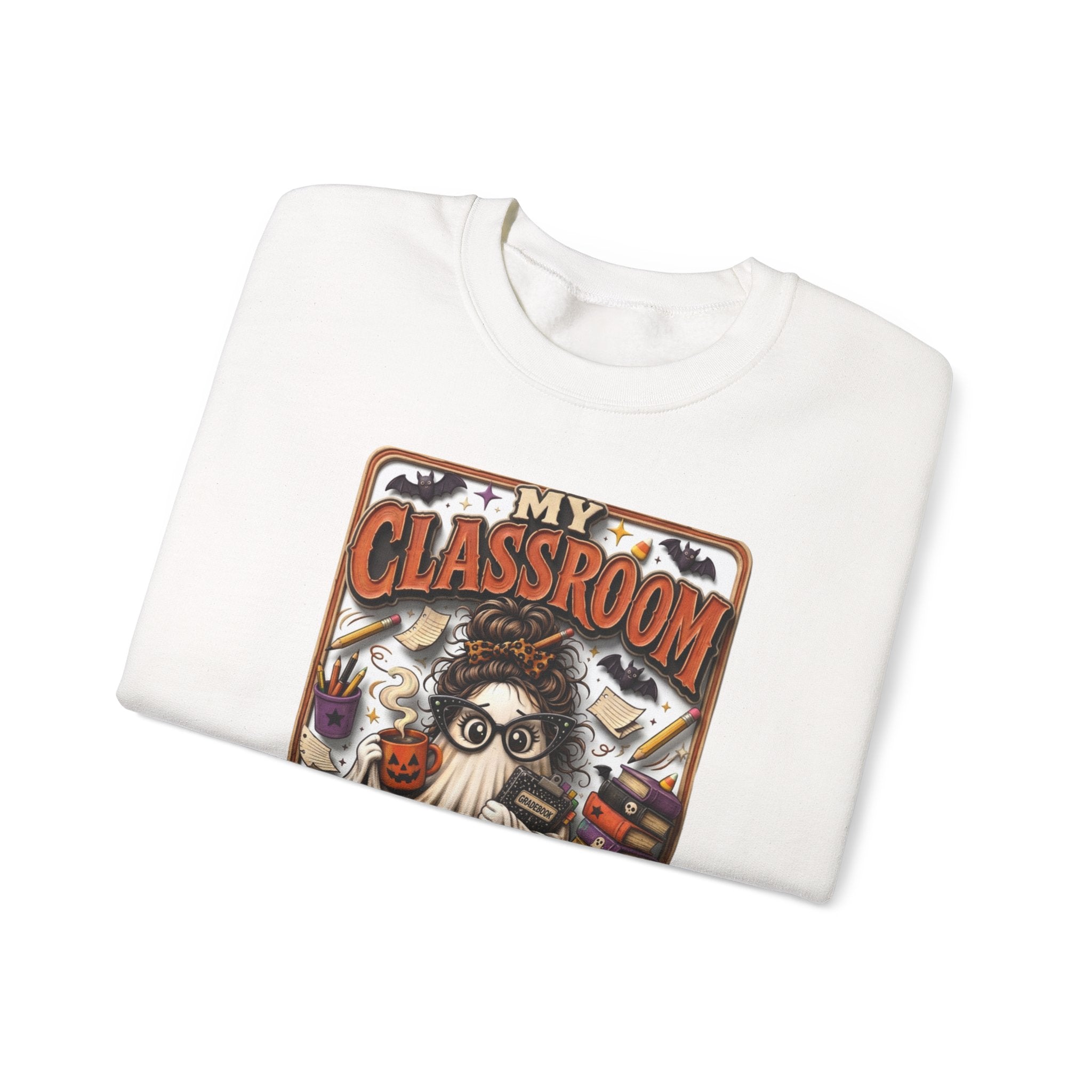 White crewneck sweatshirt folded to show the bespectacled ghost with a messy bun grades away among print