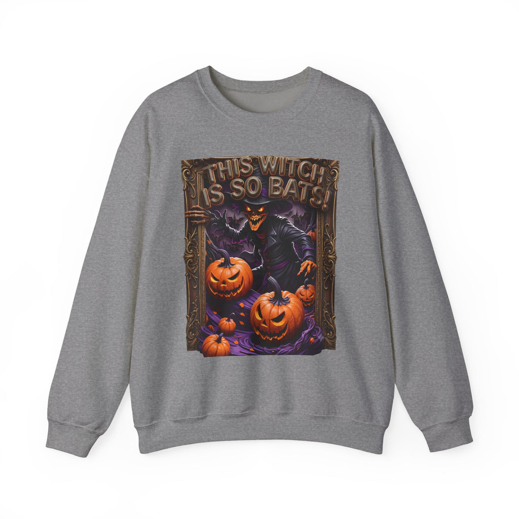 Graphite Heather crewneck sweatshirt laid flat, printed with a grinning witch in a pointed hat looms over glowing
