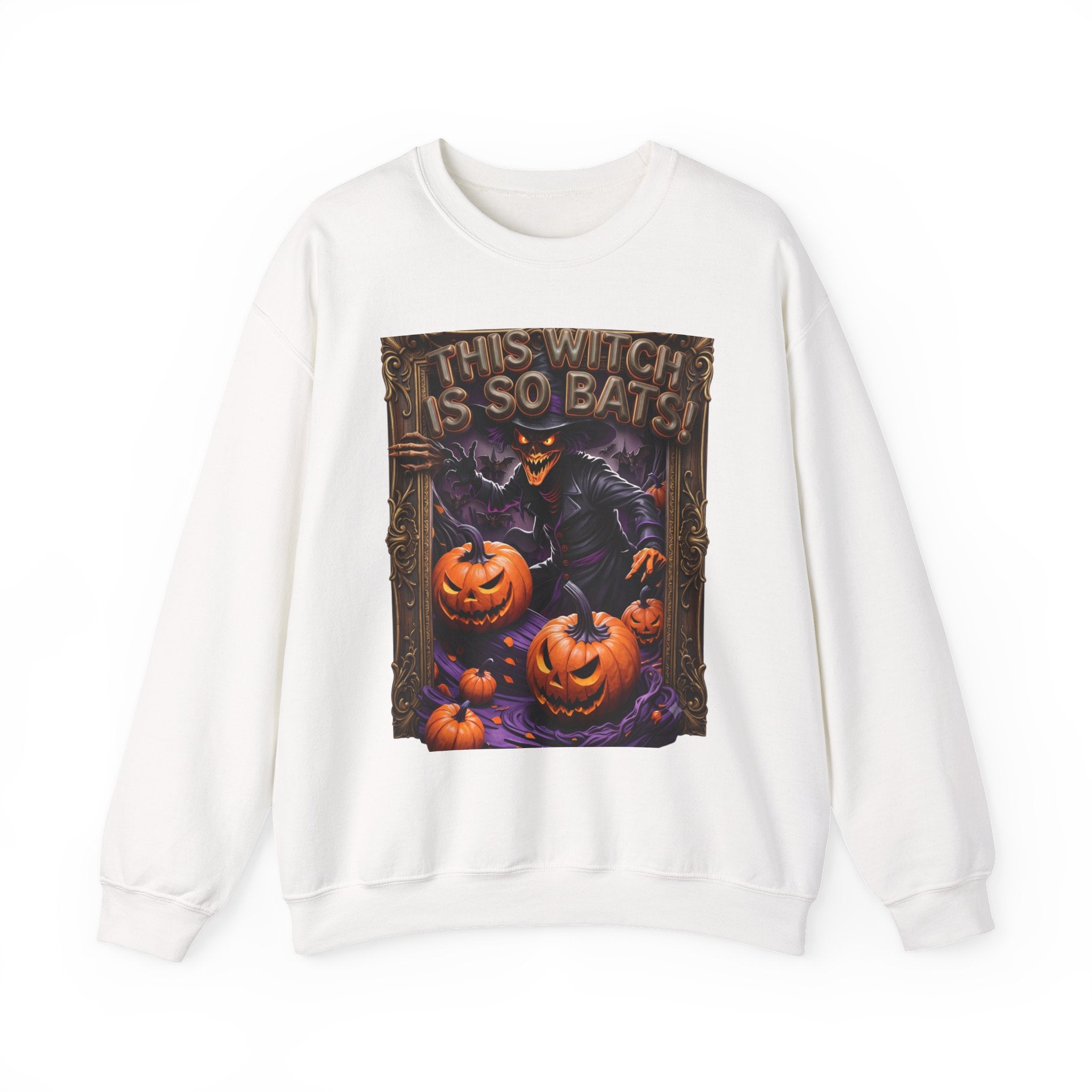 White crewneck sweatshirt laid flat, printed with a grinning witch in a pointed hat looms over glowing