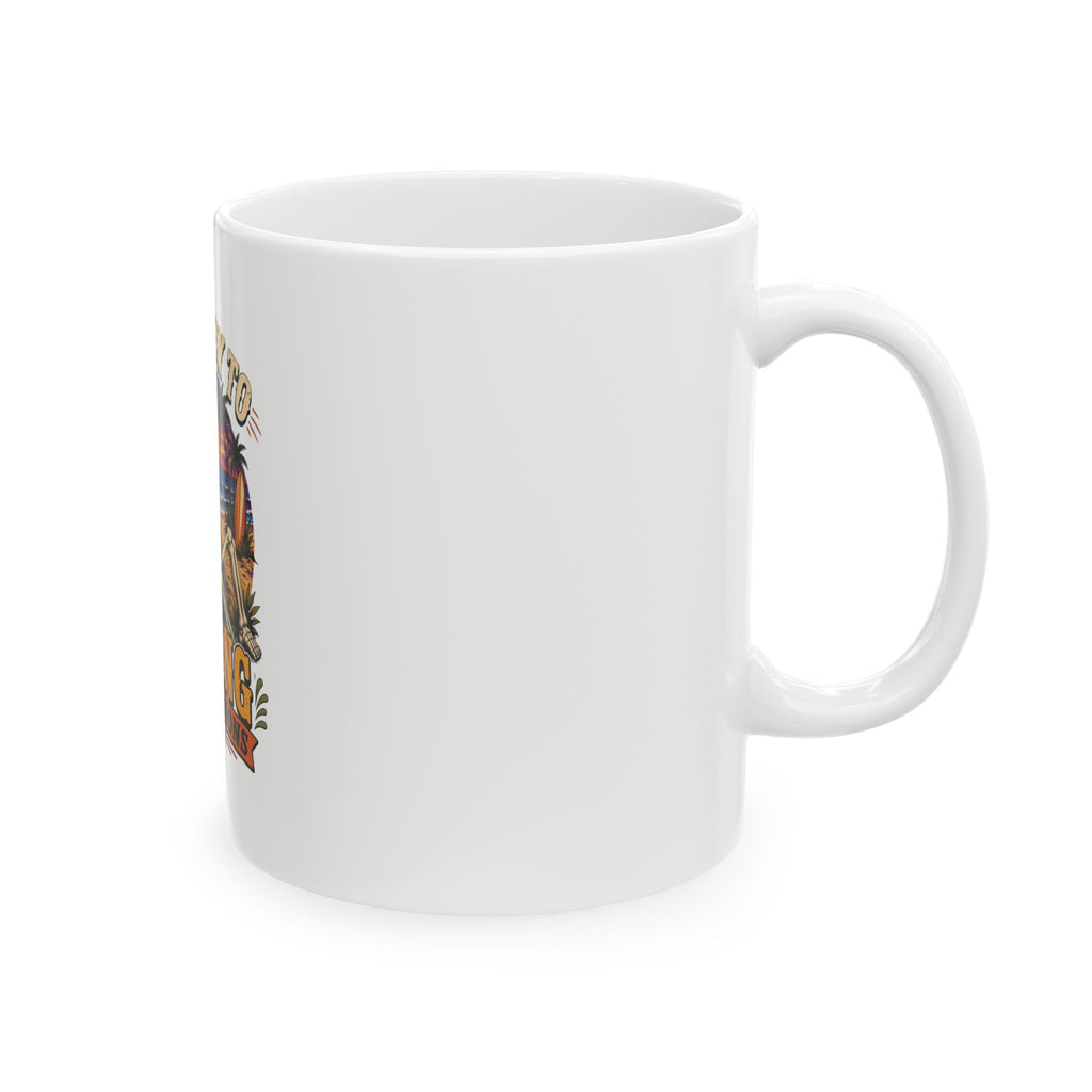 Ceramic mug showing a wraparound tropical sunset scene of a skeleton, view 4