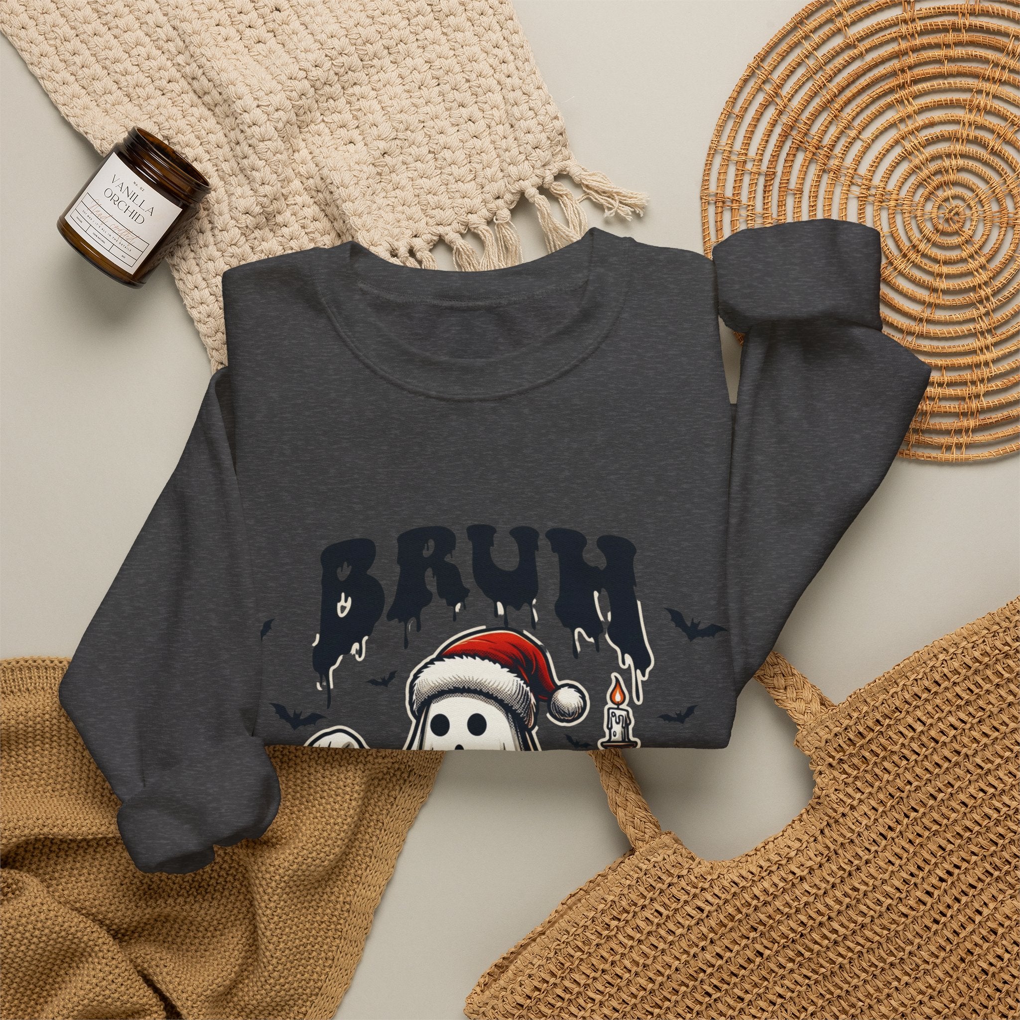 Dark Heather crewneck sweatshirt styled flat with a candle — ghost in a Santa hat
