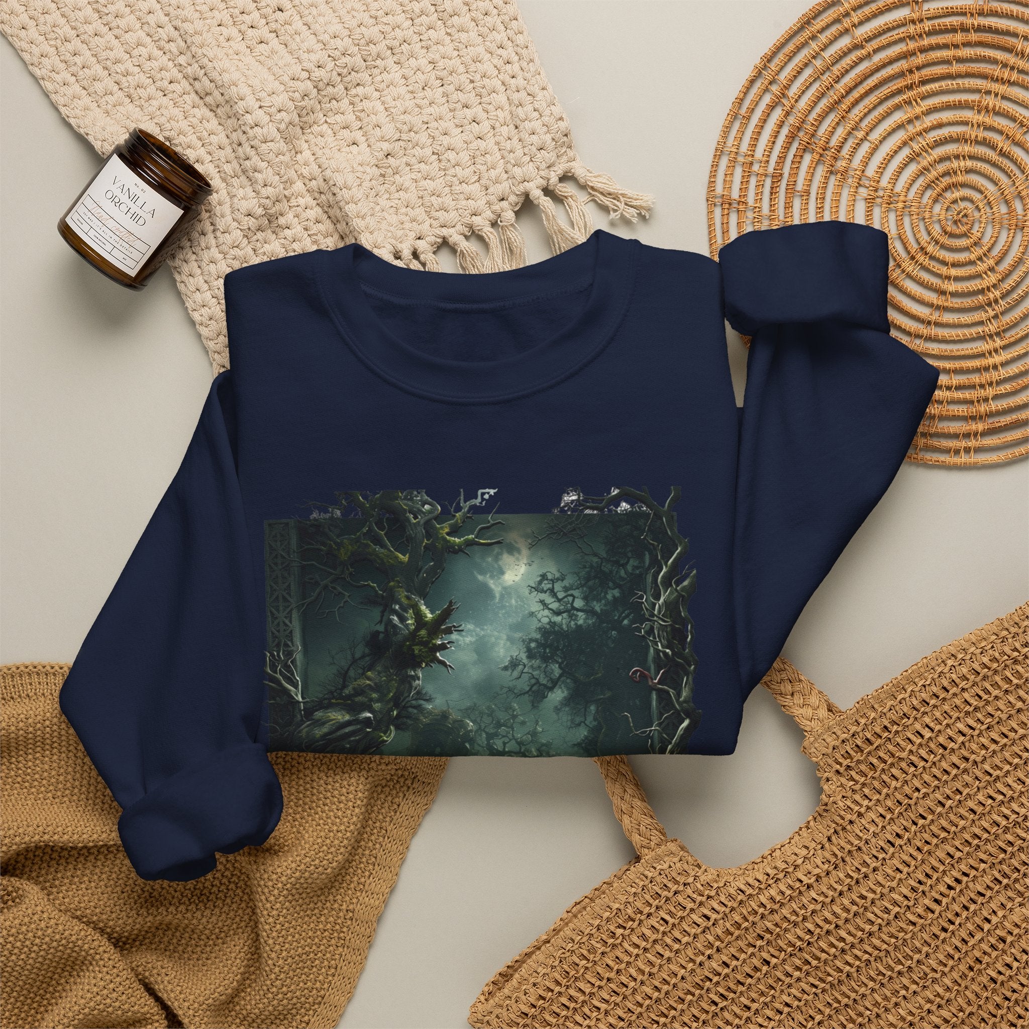 Navy crewneck sweatshirt styled flat with a candle — moonlit forest of gnarled mossy trees
